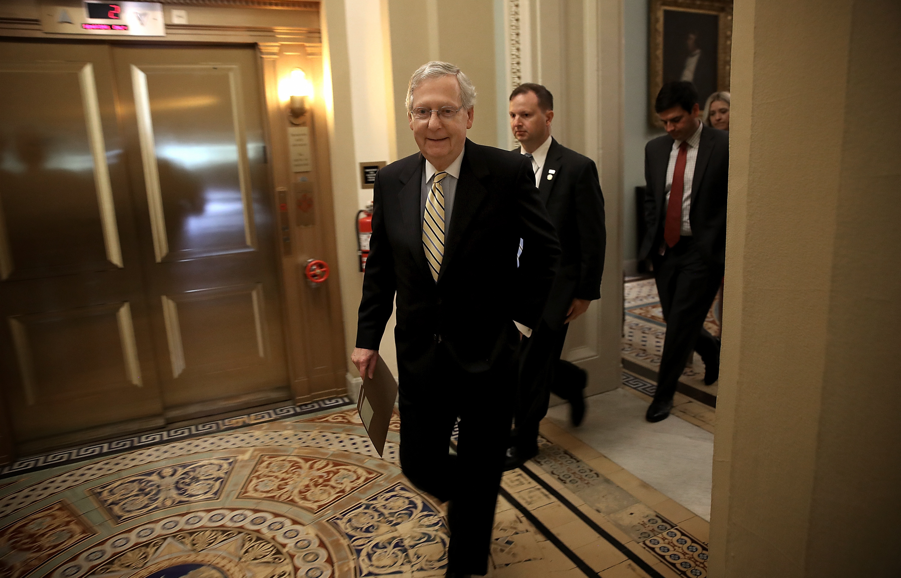 Senate Majority Leader Mitch McConnell, R-Ky., walks to a meeting in the U.S. Capitol ahead of the Senate vote to open debate on health care. (Getty Images)