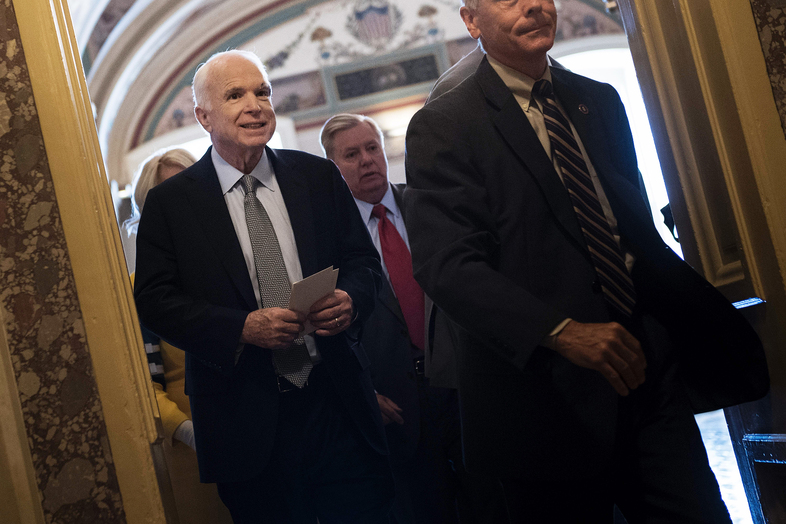 Senator John McCain leaves after a procedural vote on healthcare on Thursday, as the Senate was to vote on moving head on health care with the goal of erasing much of Barack Obama's law. (Brendan Smialowski/AFP/Getty Images)