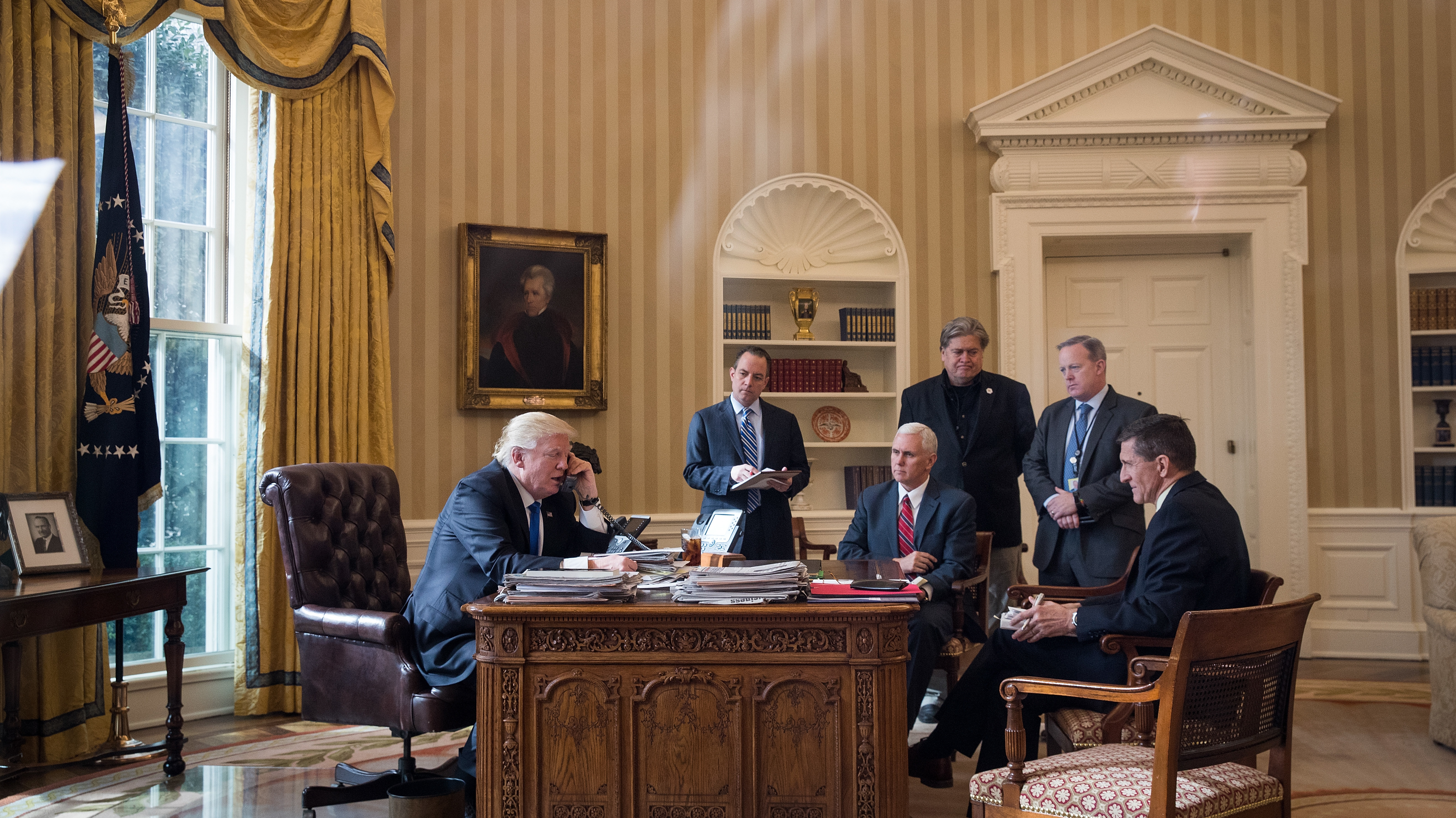 With President Trump in January: White House chief of staff Reince Priebus (from second left), Vice President Pence, chief strategist Steve Bannon, press secretary Sean Spicer and national security adviser Michael Flynn listen. Just six months later, only Bannon is still serving in the Trump-Pence administration. (Getty Images)