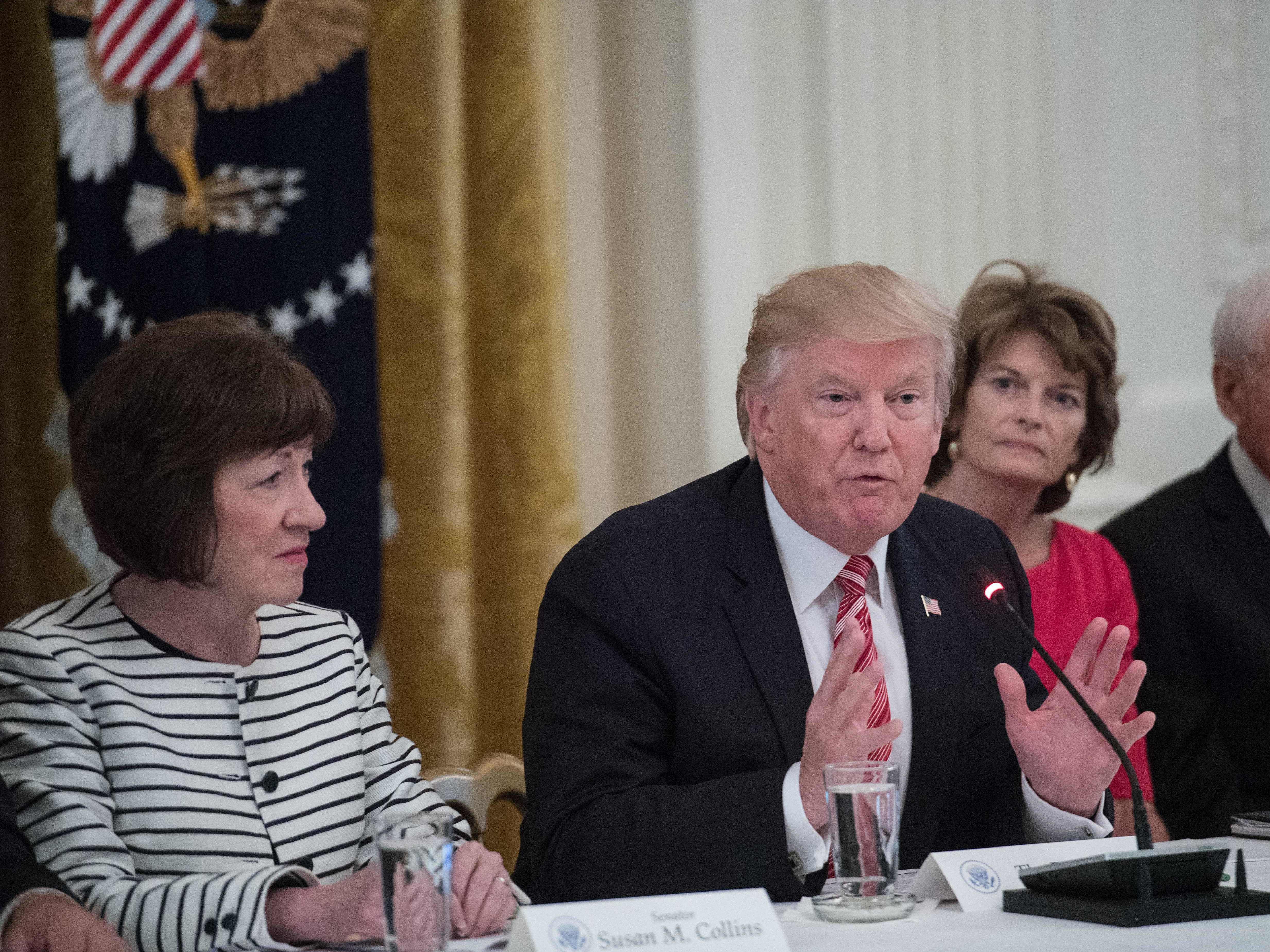 President Trump flanked by Sens. Susan Collins, of Maine, (L) and Lisa Murkowski, of Alaska, (R) as GOP senators meet with Trump to discuss the health care bill at the White House on June 27, 2017. (AFP/Getty Images)