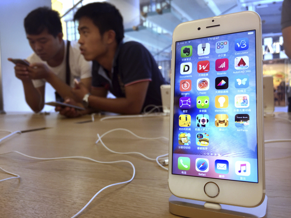 Apple has been accused of removing apps from its China App Store that can be used to skirt the country's Internet filters. Above, customers at an Apple Store in Beijing in 2016. (Mark Schiefelbein/AP)