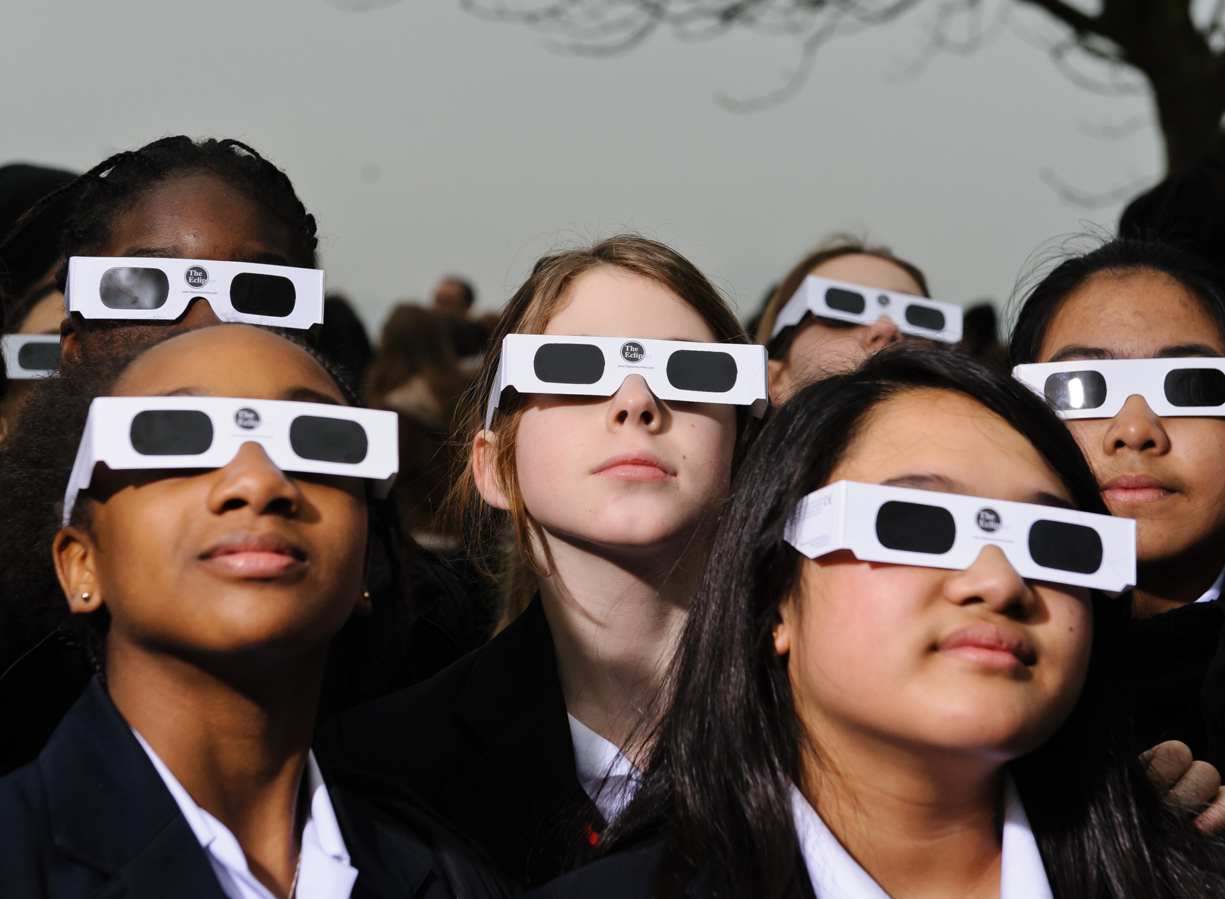 Proper eye protection is a must for anyone looking up at a solar eclipse. Eclipse glasses are far darker than regular sunglasses. (Joseph Okpako/Getty Images)