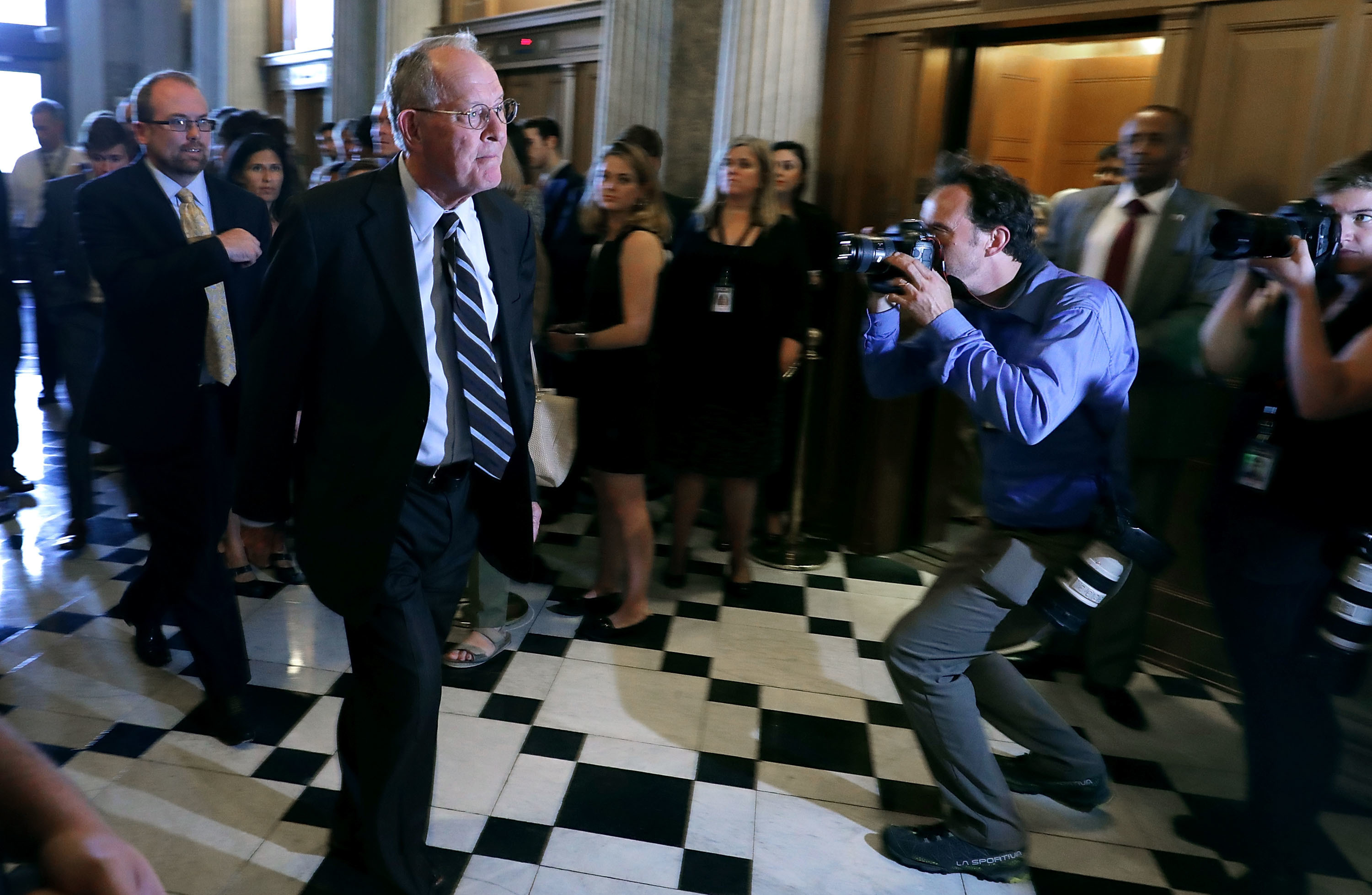 Sen. Lamar Alexander, R-Tenn., walks to the Senate chamber for a vote in the U.S. Capitol on July 26. He and Democratic Sen. Patty Murray of Washington announced Tuesday they would begin to hold health care hearings in September. (Getty Images)