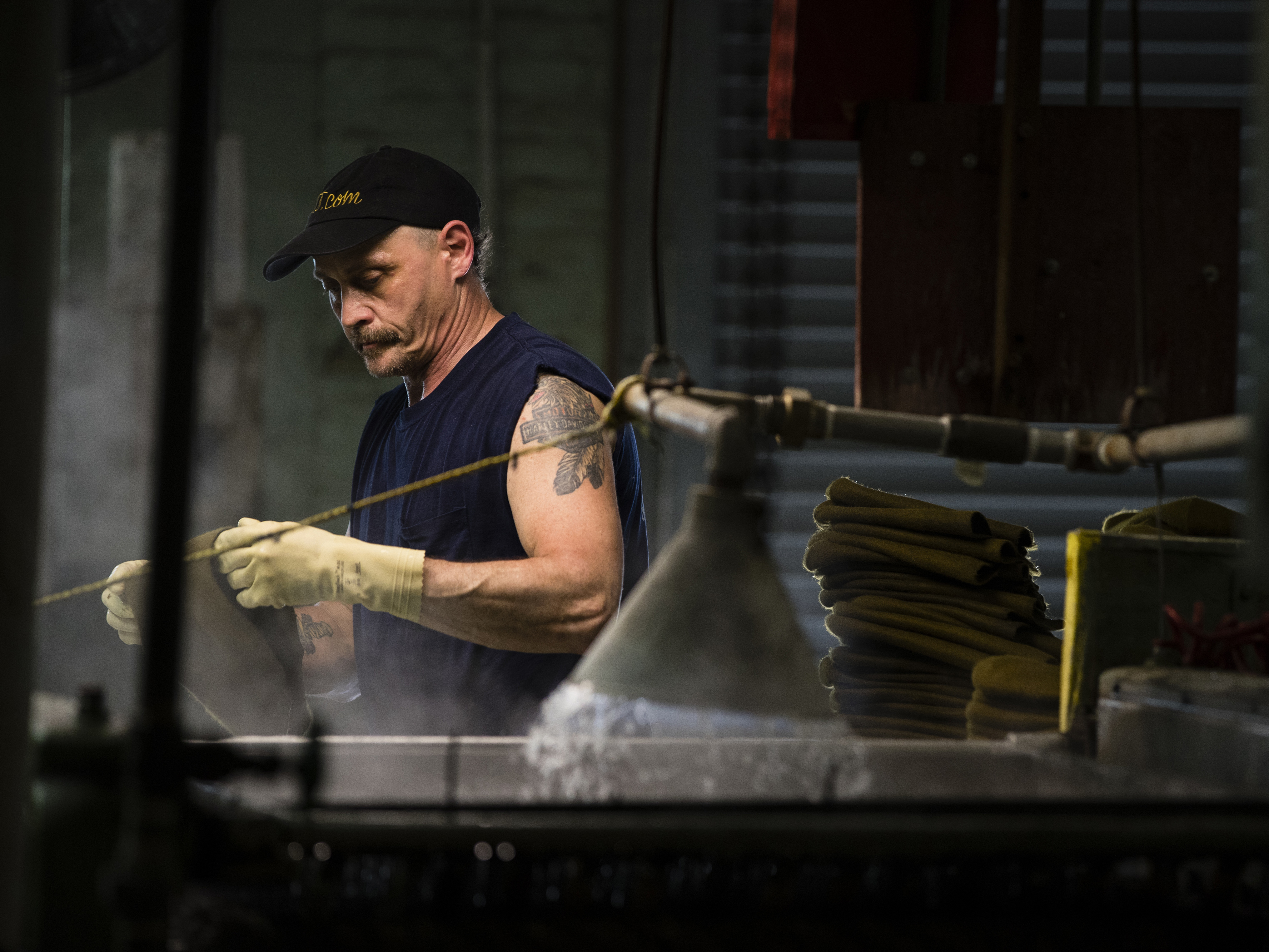 A worker at the Bollman Hat Co. in Adamstown, Pa. Economists say the pickup in U.S. wages has been sluggish. One possible reason is that baby boomers are leaving the workforce in their peak earning years.