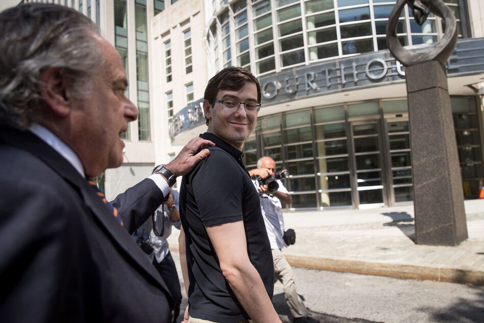 Former pharmaceutical executive Martin Shkreli (right) walks with lead defense attorney Benjamin Brafman after the jury convicted Shkreli on two counts of securities fraud and one count of conspiracy to commit securities fraud. (Drew Angerer/Getty Images)