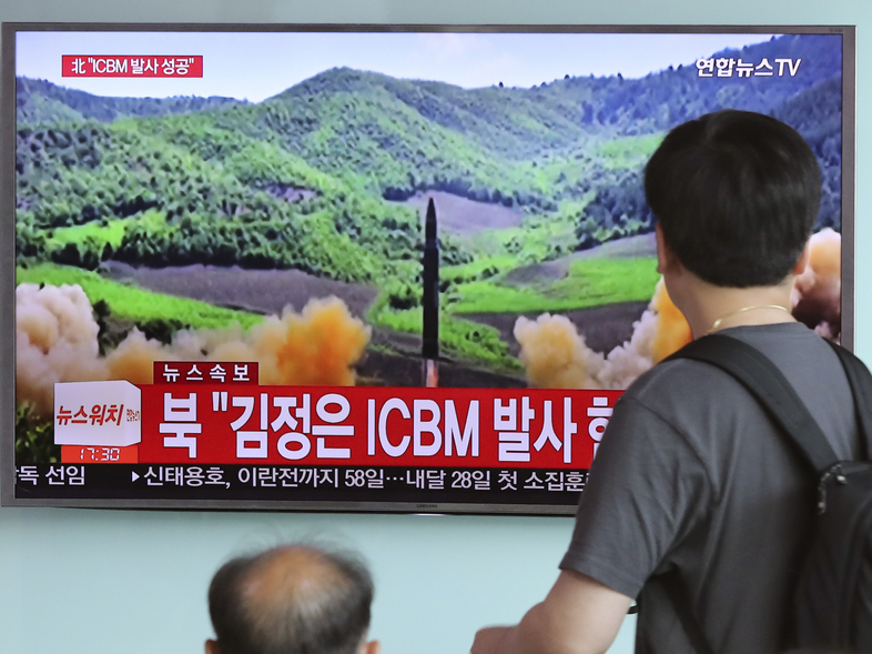 South Koreans watch television coverage of the July 4 launch of a Hwasong-14 intercontinental ballistic missile, ICBM, in North Korea. (Lee Jin-man/AP)