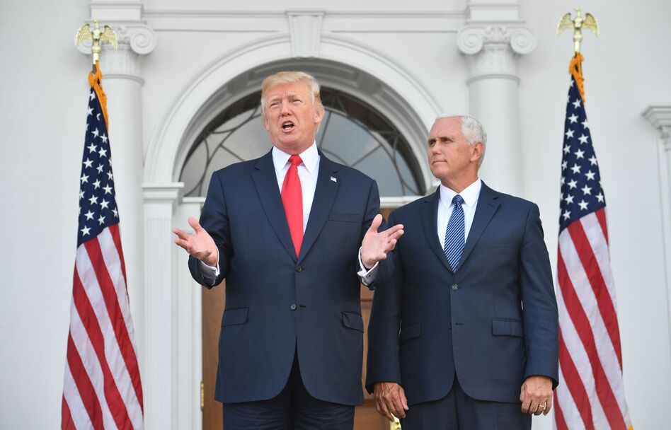 President Trump and Vice President Pence speak to the press on Thursday at the Trump National Golf Club in New Jersey before a security briefing. Trump said he would declare the opioid crisis a national emergency. (Nicholas Kamm/AFP/Getty Images)