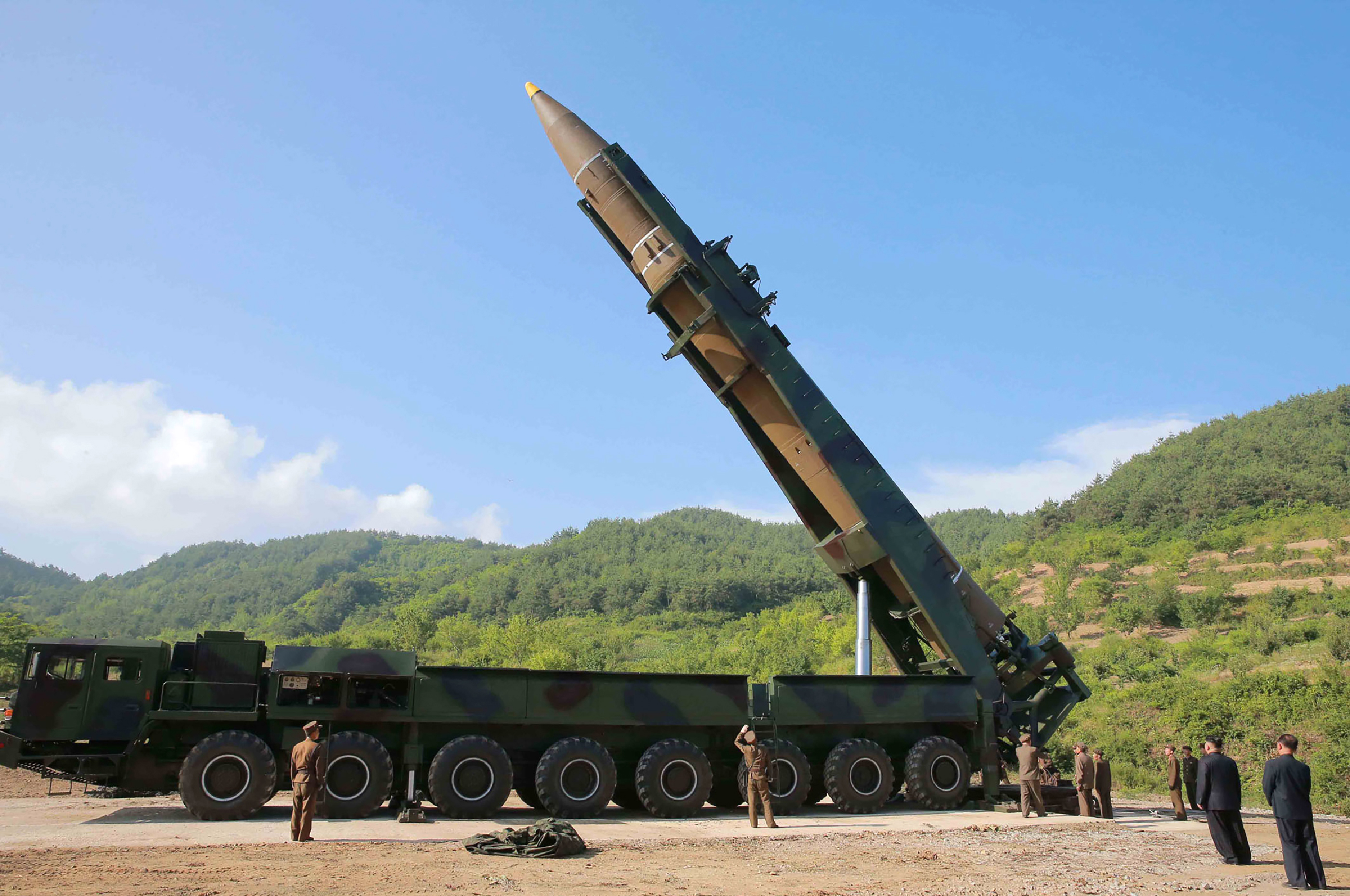 This picture taken and released on July 4 by an official North Korea news agency shows  leader Kim Jong-Un (second from right) inspecting the test firing of a Hwasong-14 ICBM at an undisclosed location. (STR/AFP/Getty Images)