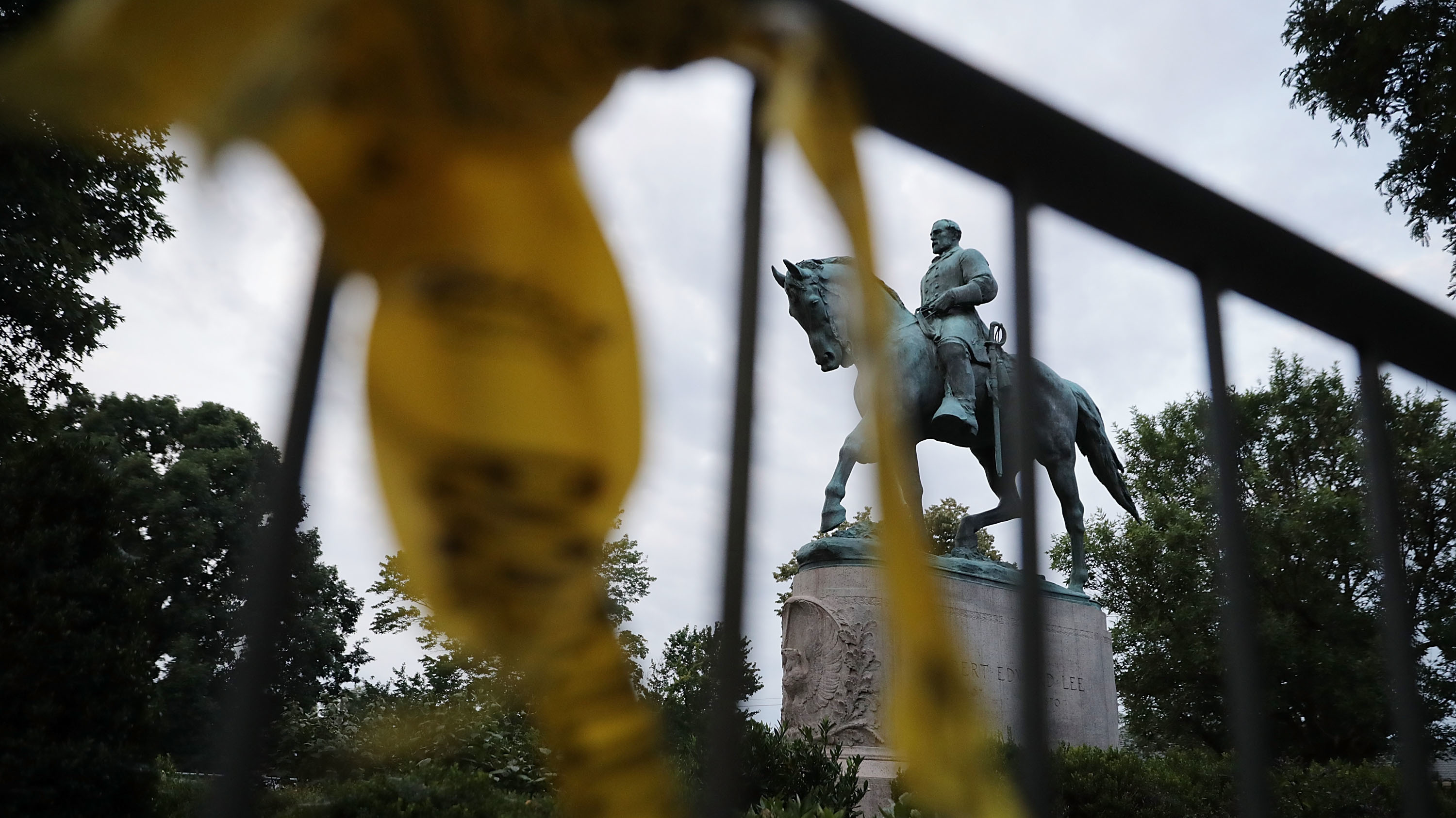 The statue of Confederate Gen. Robert E. Lee stands in the center of Emancipation Park the day after violence broke out in Charlottesville, Va. The &quot;Unite the Right&quot; rally aimed to save the statue, which the city council has voted to remove. But several cities have now reacted to the rally by hastening the removal of their own Confederate monuments. (Getty Images)