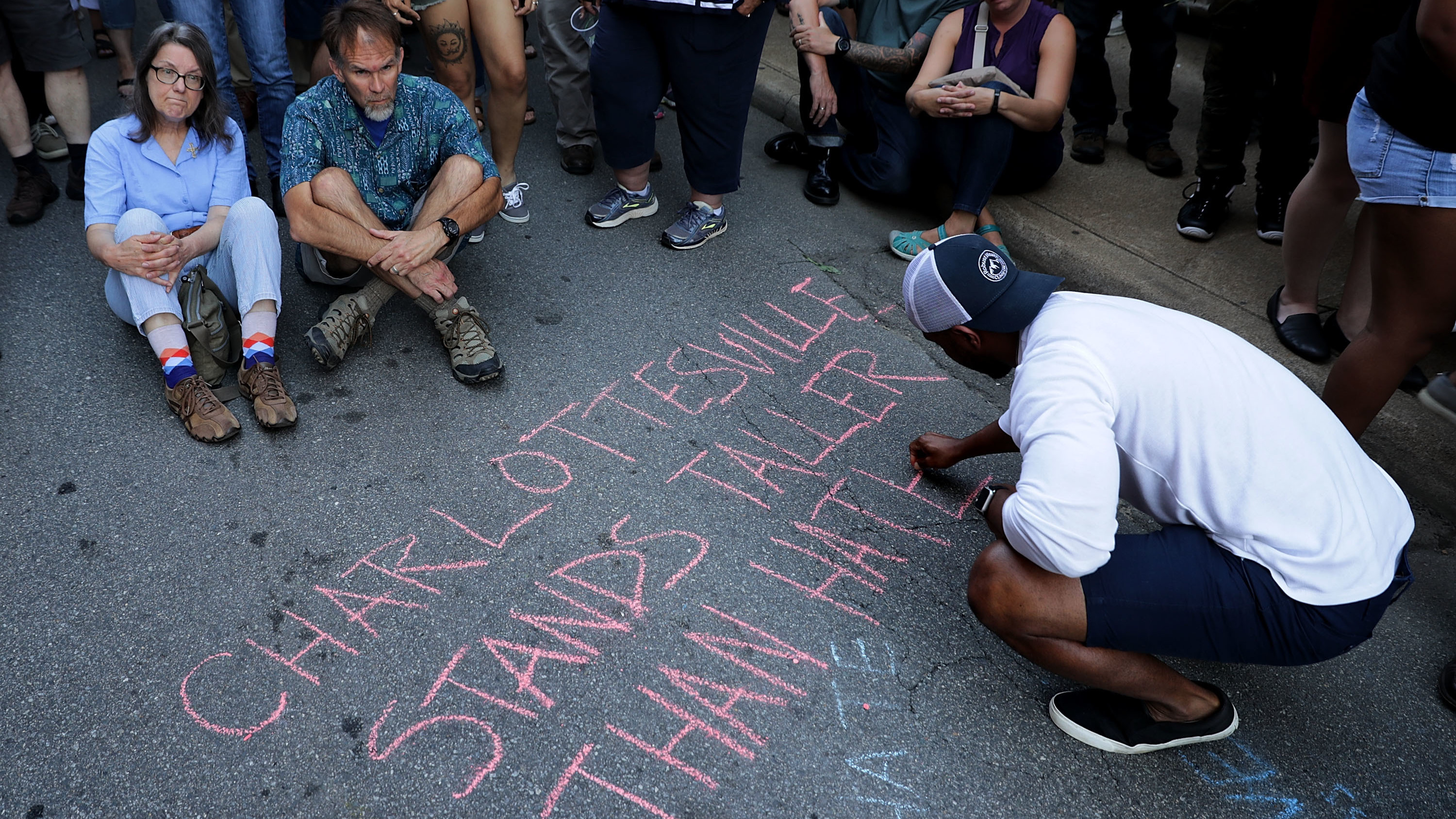 Hundreds of people gather for a vigil on the spot where 32-year-old Heather Heyer was killed when a car plowed into a crowd of people protesting against the white supremacist &quot;Unite the Right&quot; rally in Charlottesville, Va. (Getty Images)