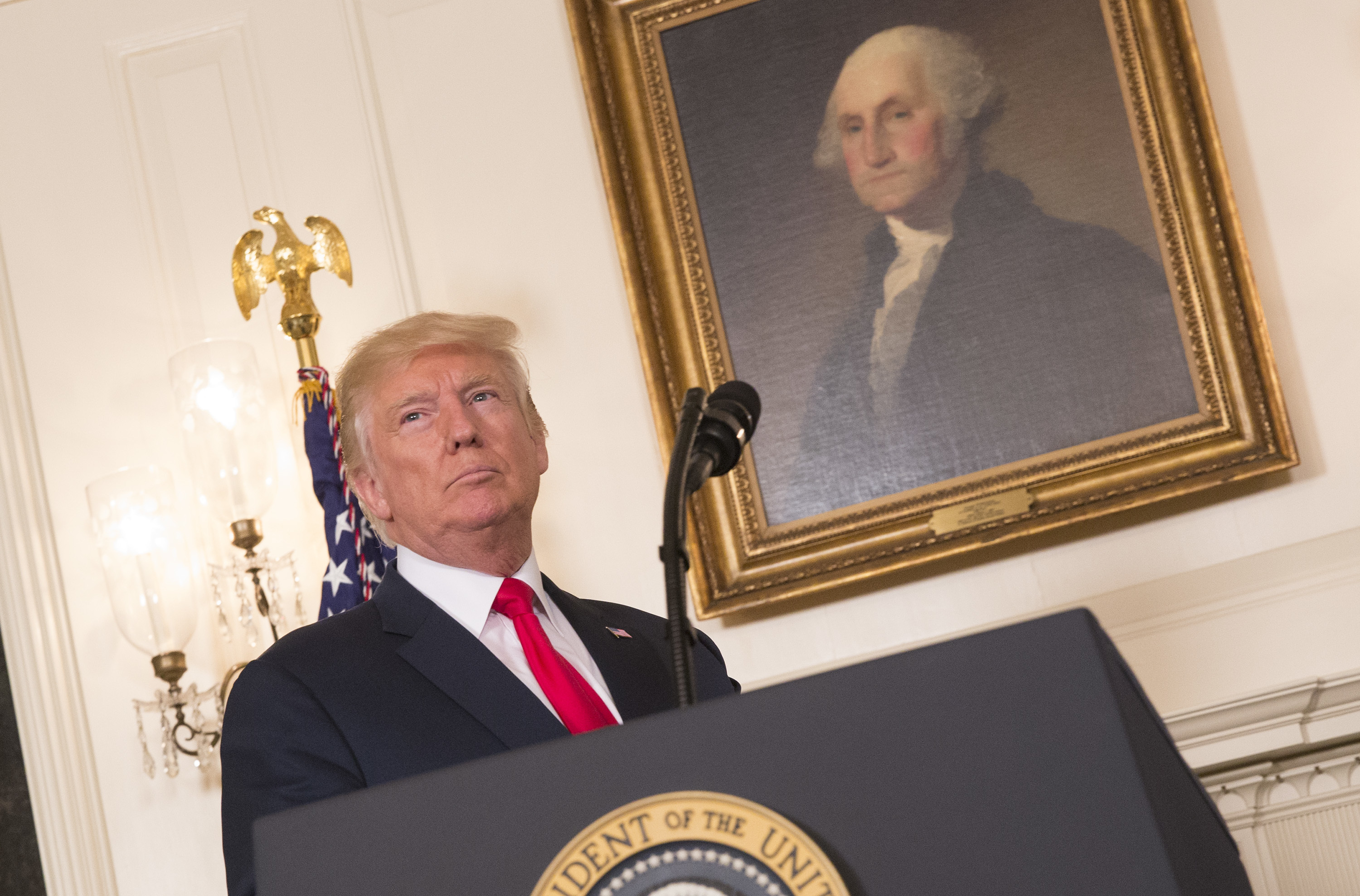 President Trump prepares on Monday to make a statement denouncing white supremacists who participated in the weekend violence in Charlottesville, Va. (Getty Images)