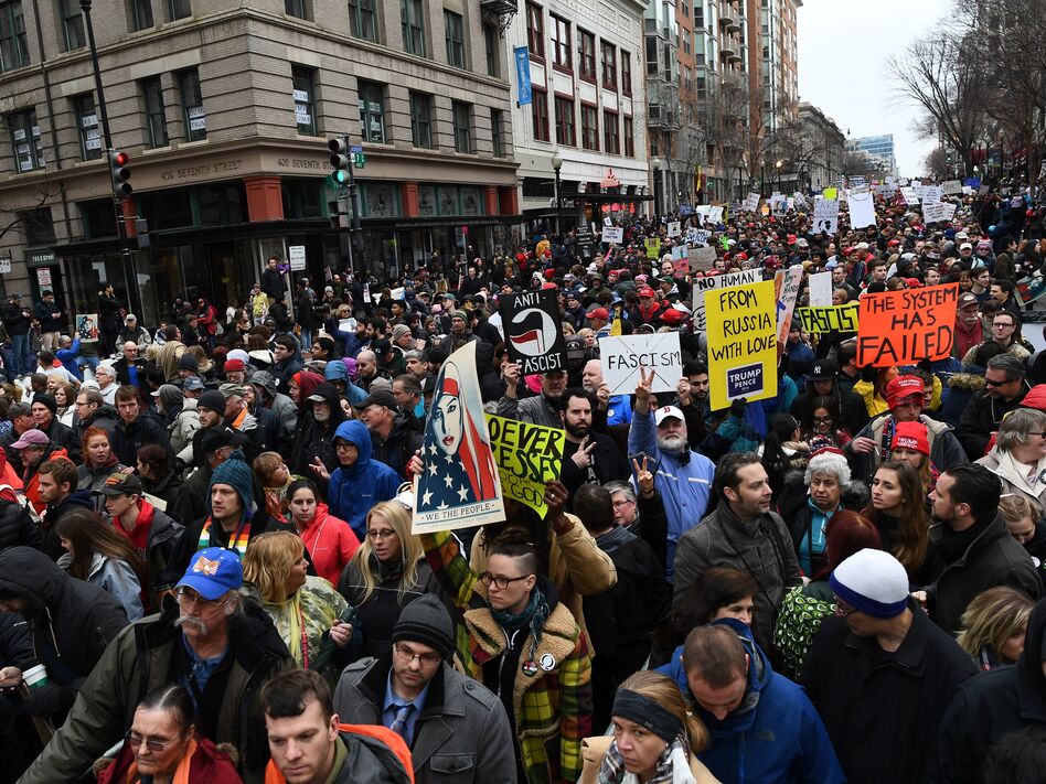The Department of Justice has issued a warrant for a web hosting company to turn over all records related to the website of #DisruptJ20, a group that organized actions to spoil President Trump's inauguration in January. (Jewel Samad/AFP/Getty Images)