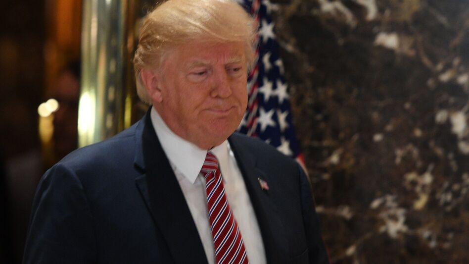 Faced with a string of resignations from his advisory panels, President Trump has disbanded two groups he had formed to provide policy and economic guidance. He's seen here after a news conference Tuesday. (Jim Watson/AFP/Getty Images)