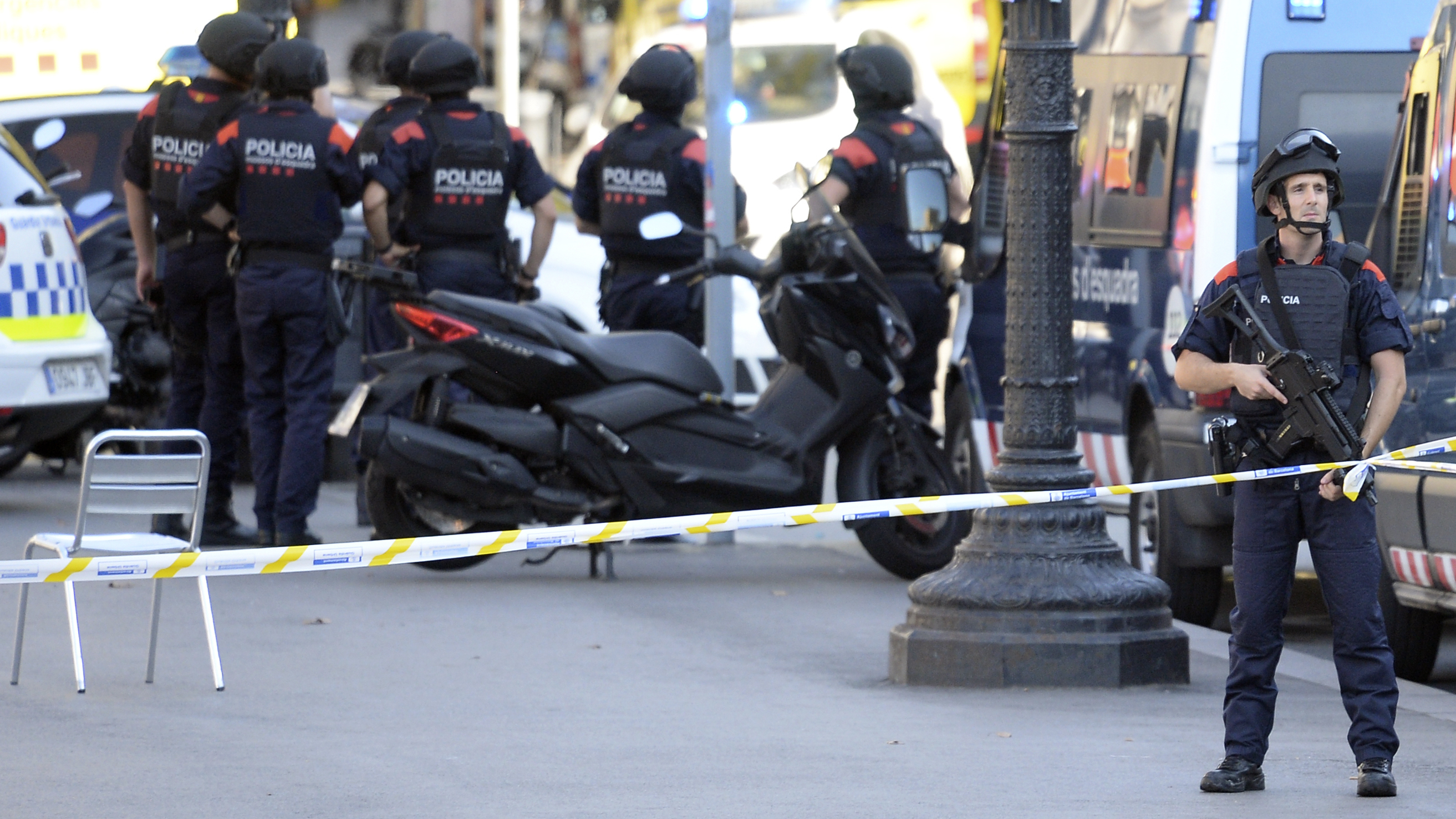 Armed policemen stand in a cordoned-off area on the Rambla in Barcelona, after a van drove into a crowd of pedestrians. Police say the deadly incident was a terror attack. (Josep Lago/AFP/Getty Images)