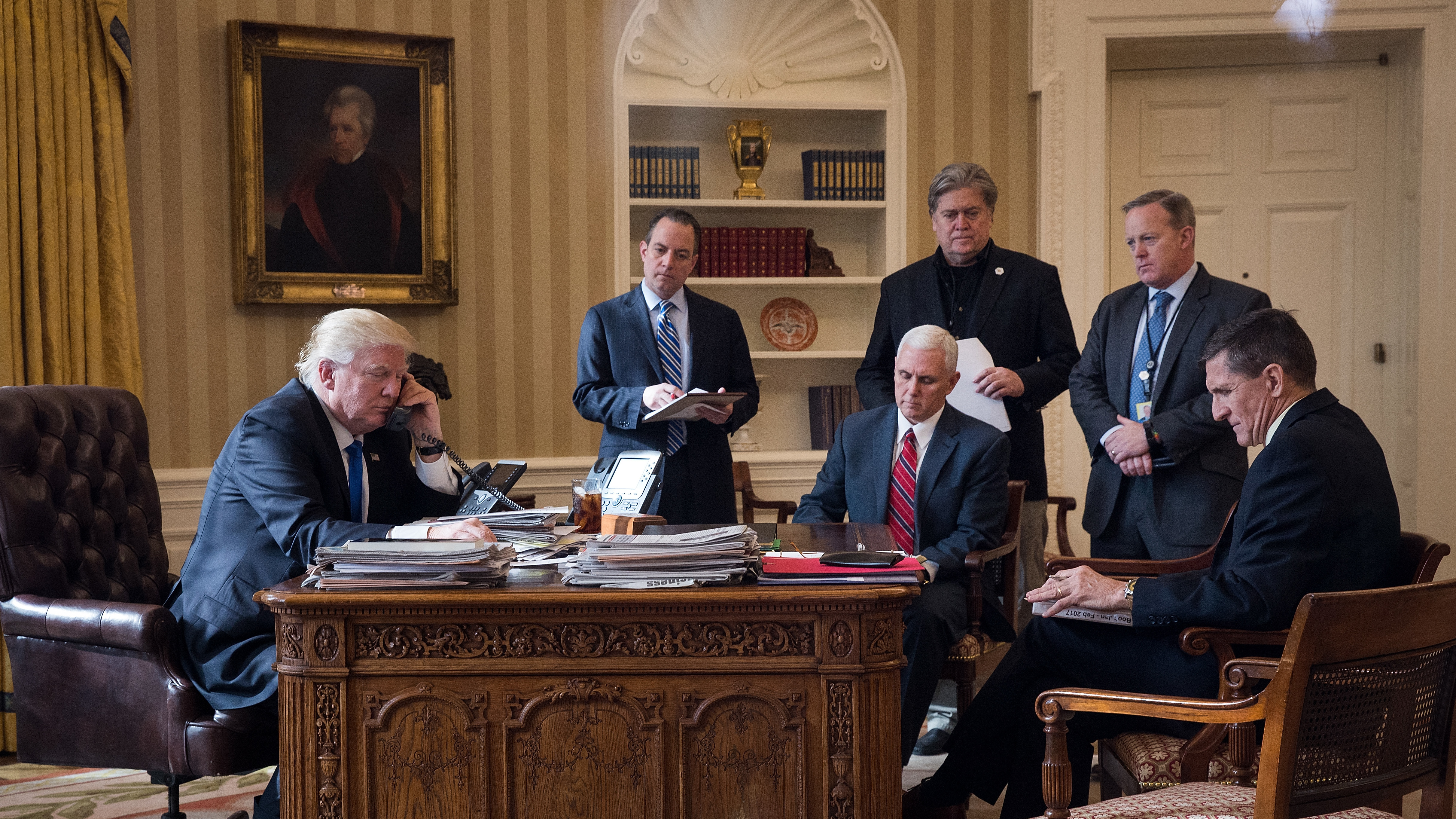 President Trump speaks on the phone in January with Russian President Vladimir Putin, joined by top White House figures Reince Priebus (from left), Vice President Pence, Steve Bannon, Sean Spicer and Michael Flynn. Only Pence remains. (Getty Images)