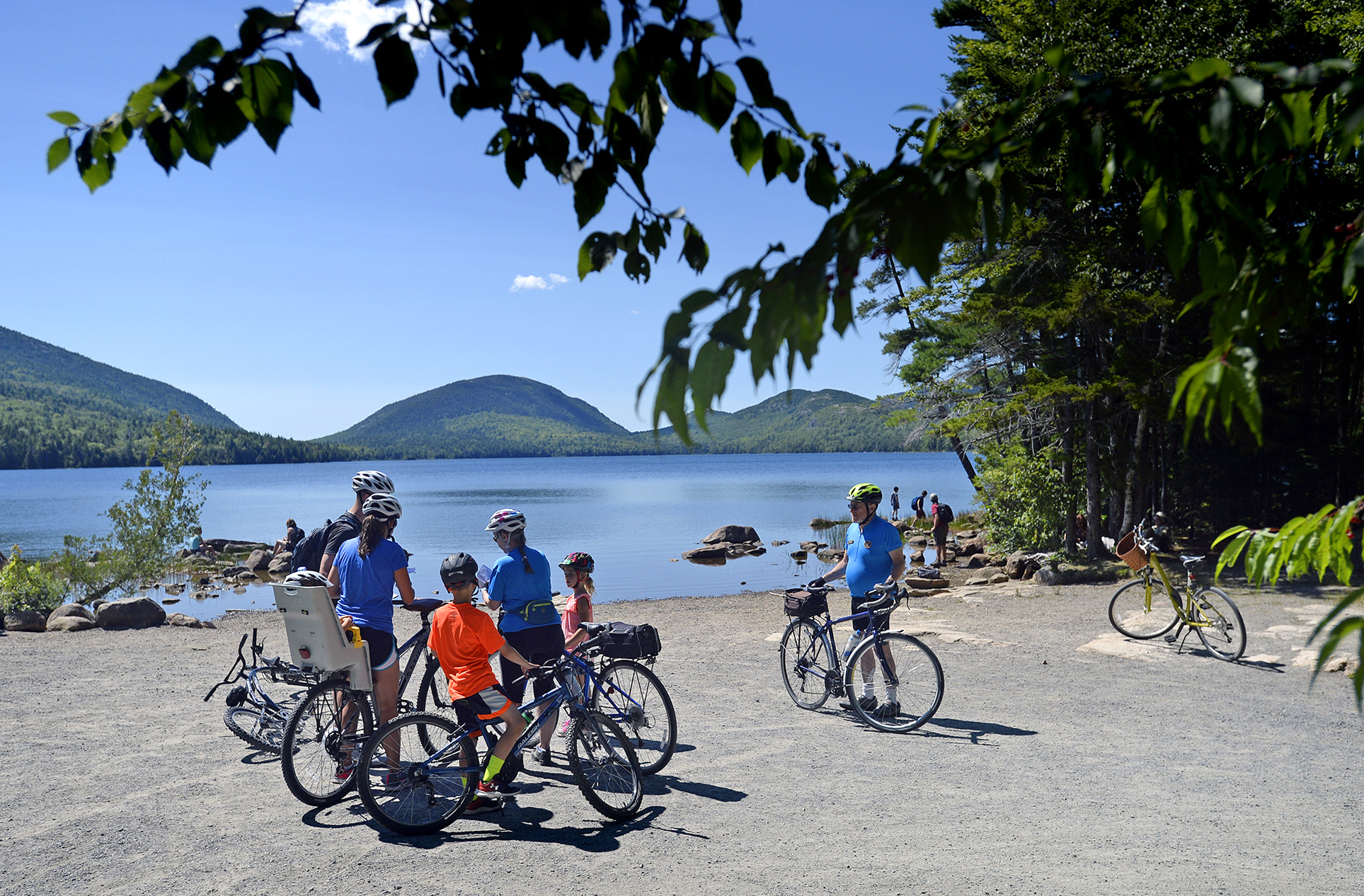 Bike patrol volunteers give directions to visitors at Acadia National Park. The Trump administration has rolled back an Obama-era policy put in place to encourage national parks to end the sale of bottled water. (Shawn Patrick Ouellette/Portland Press Herald/Getty Images)
