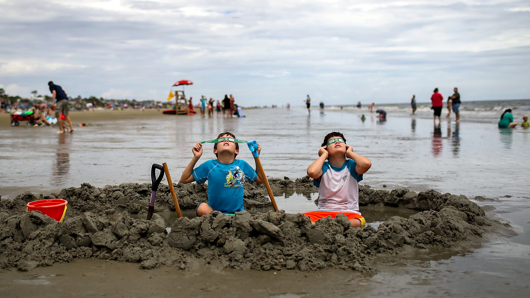 Brothers Chris and Gabe Fabiano watch the solar eclipse on Hilton Head Island, SC.