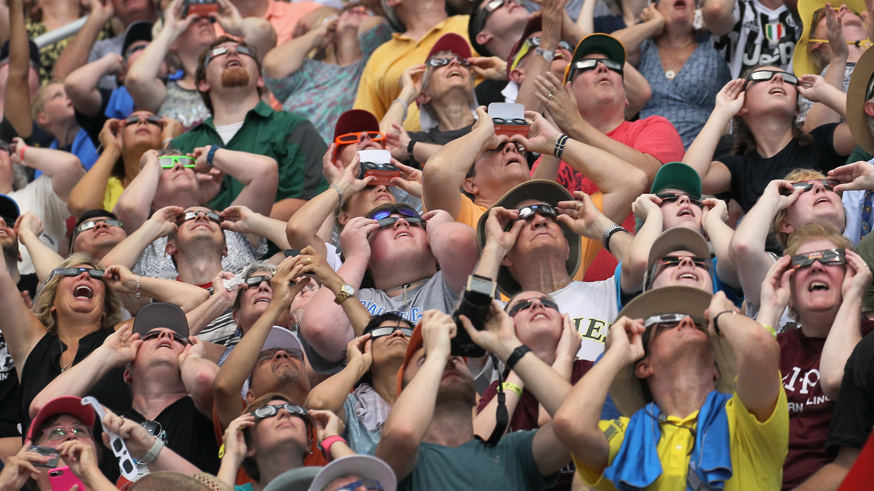 Crowds gathered to watch the solar eclipse at Saluki Stadium on the campus of Southern Illinois University in Carbondale, Ill.