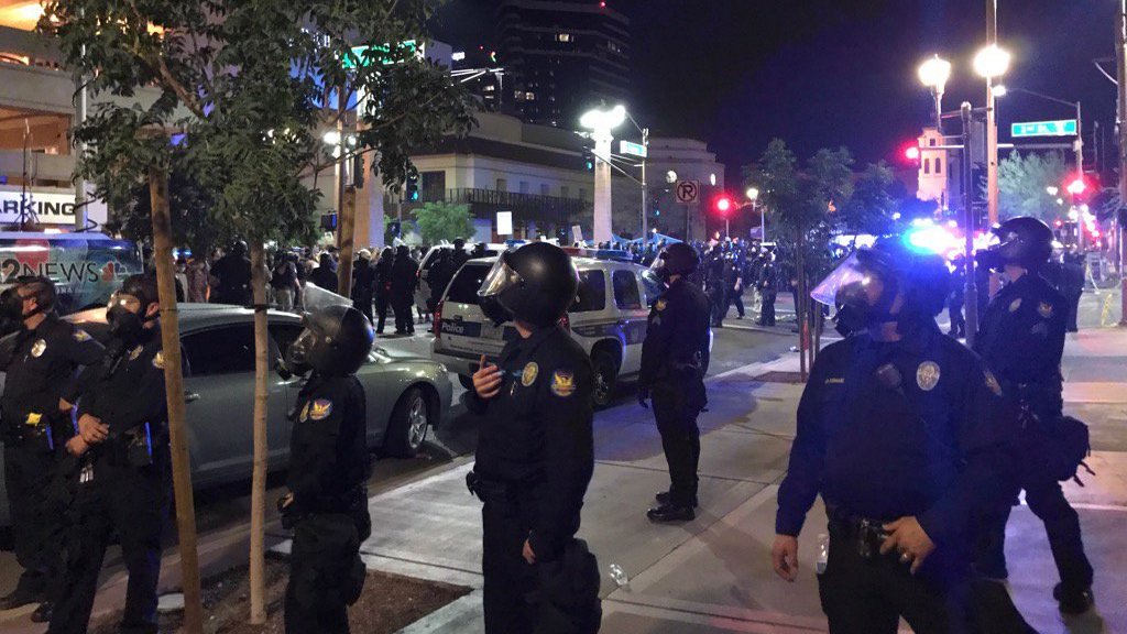 Phoenix police order protesters outside the venue where President Trump held a rally Tuesday to disperse. Officers used tear gas to try to force the crowd to leave. (NPR)
