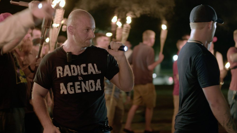 Christopher Cantwell seen in a <em>VICE News Tonight</em> video of the Aug. 11 white nationalist march in Charlottesville, Va. On Wednesday, Cantwell turned himself in to police to face three felony charges. (AP)