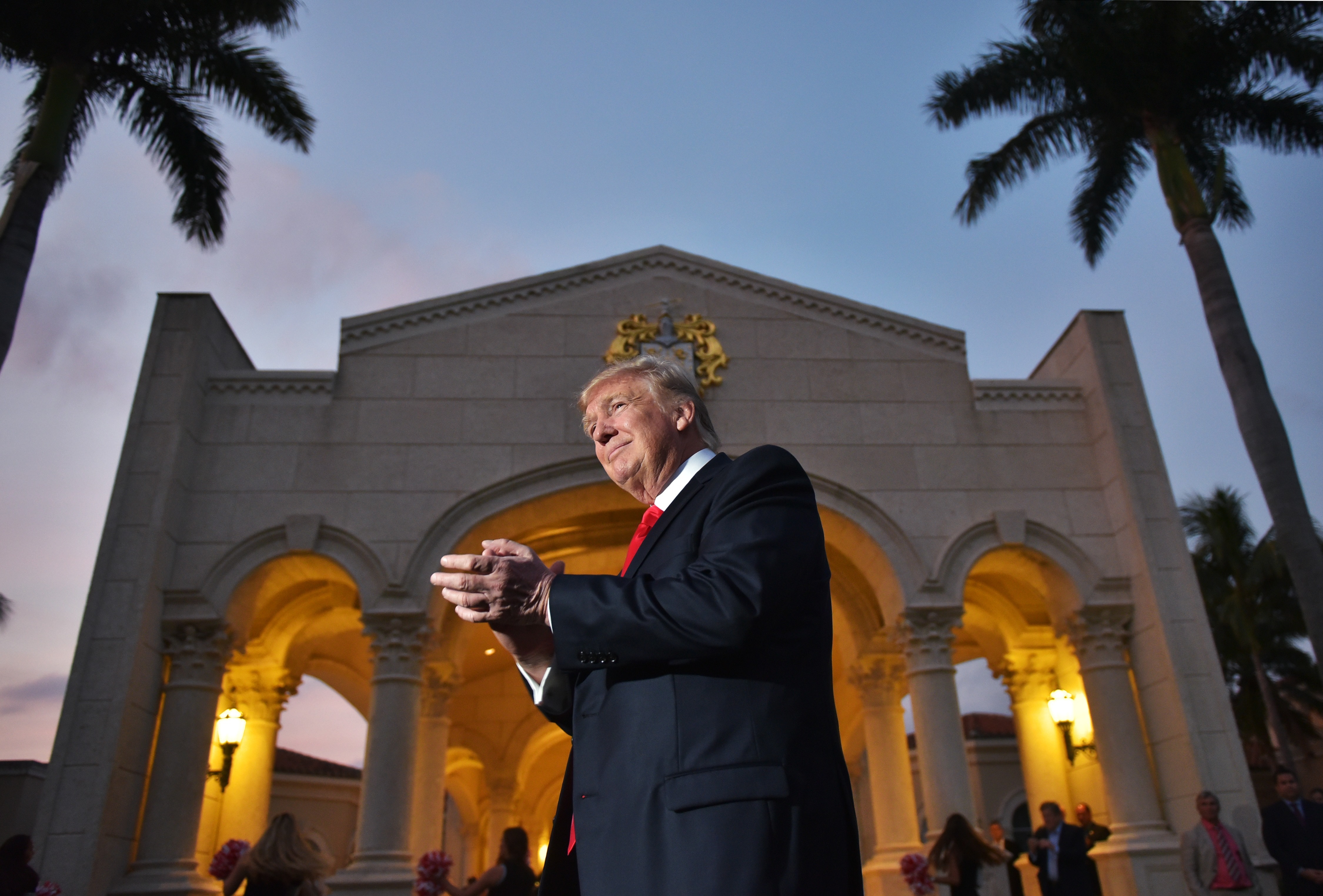 President Trump watches the Palm Beach Central High School marching band perform upon his arrival at Trump International Golf Club Palm Beach in West Palm Beach, Fla., to watch the Super Bowl on Feb. 5.