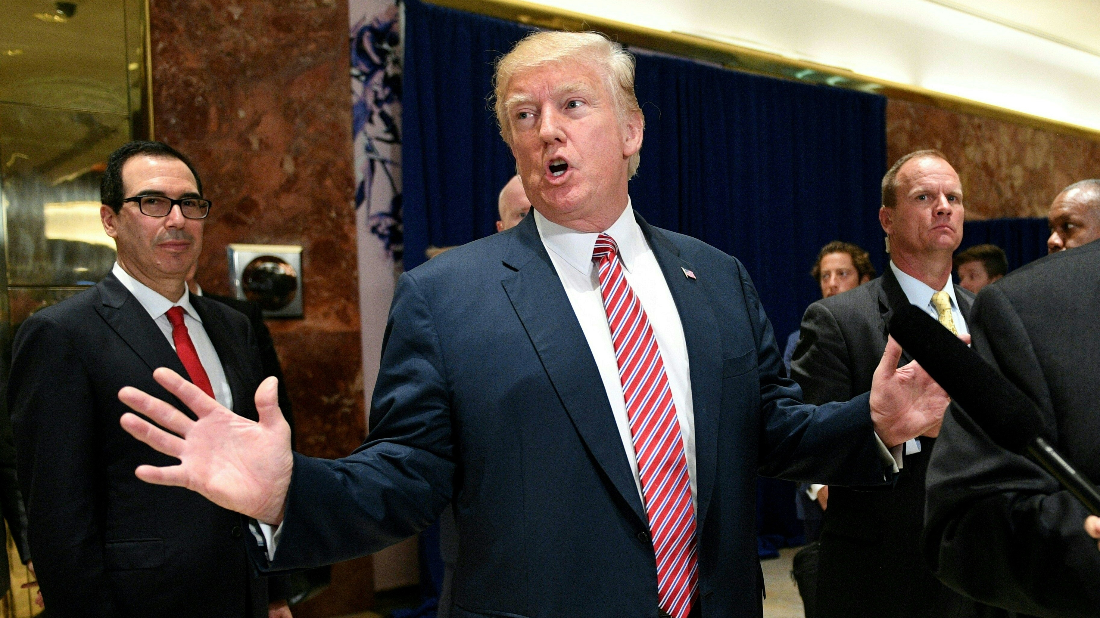 Since the violence in Charlottesville, Va., the president has said that job creation will ease America's racial tensions. That is not likely. (AFP/Getty Images)