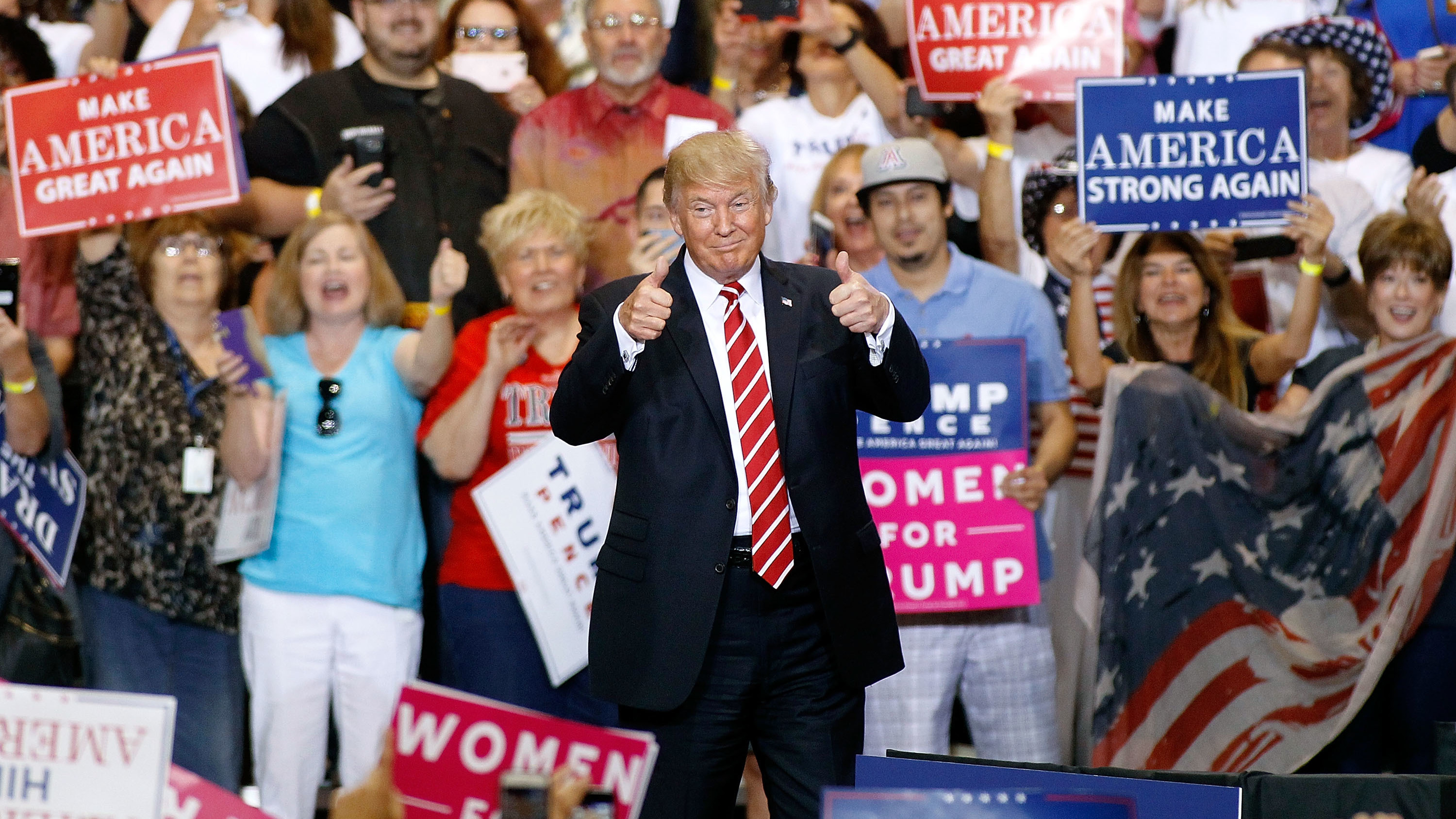 President Trump gives two thumbs-up to a crowd of supporters at the Phoenix Convention Center during a rally this week. (Getty Images)