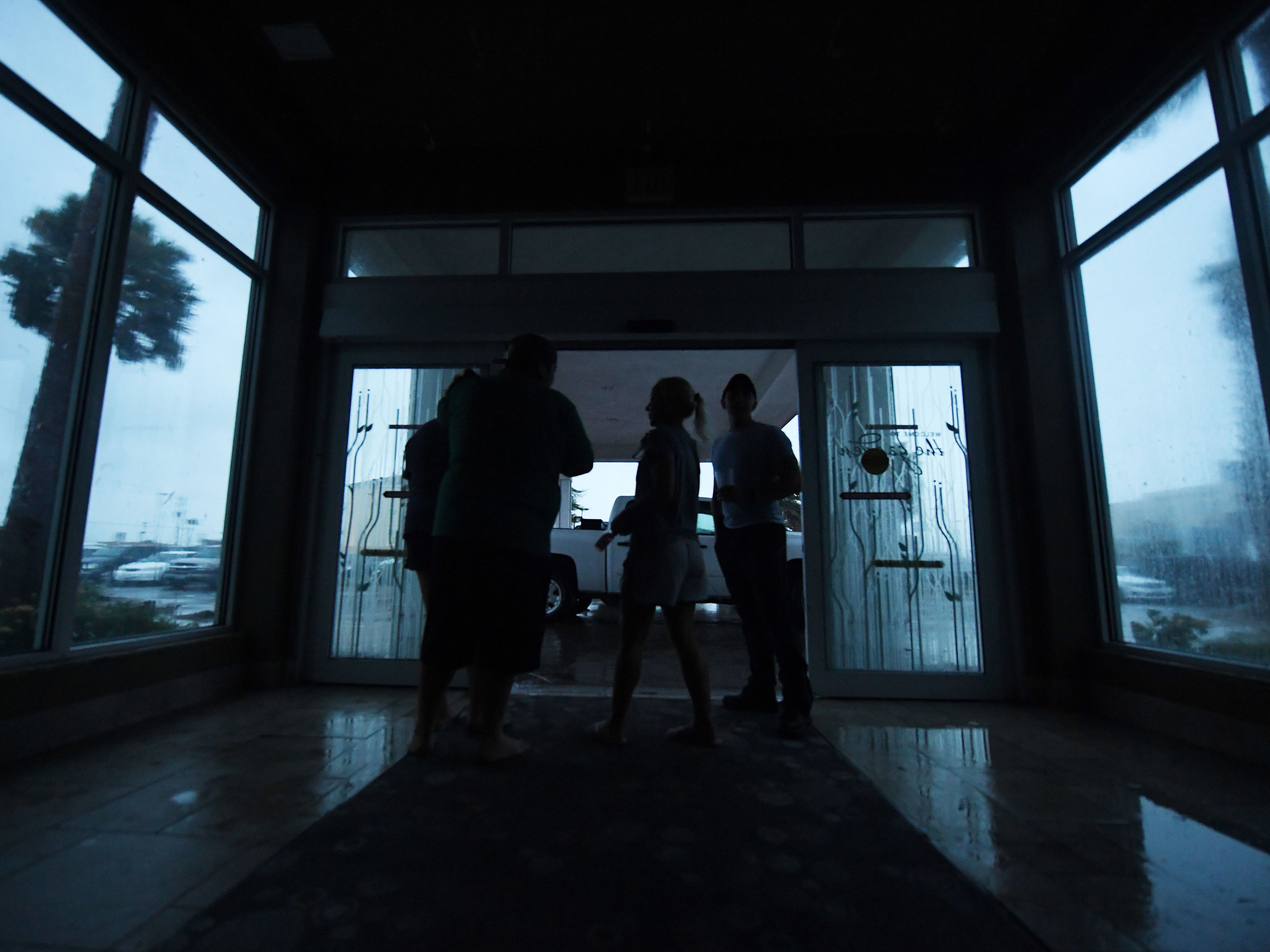 Corpus Christi, Texas, residents watch the Hurricane Harvey in the dark after a citywide power failure Friday.
