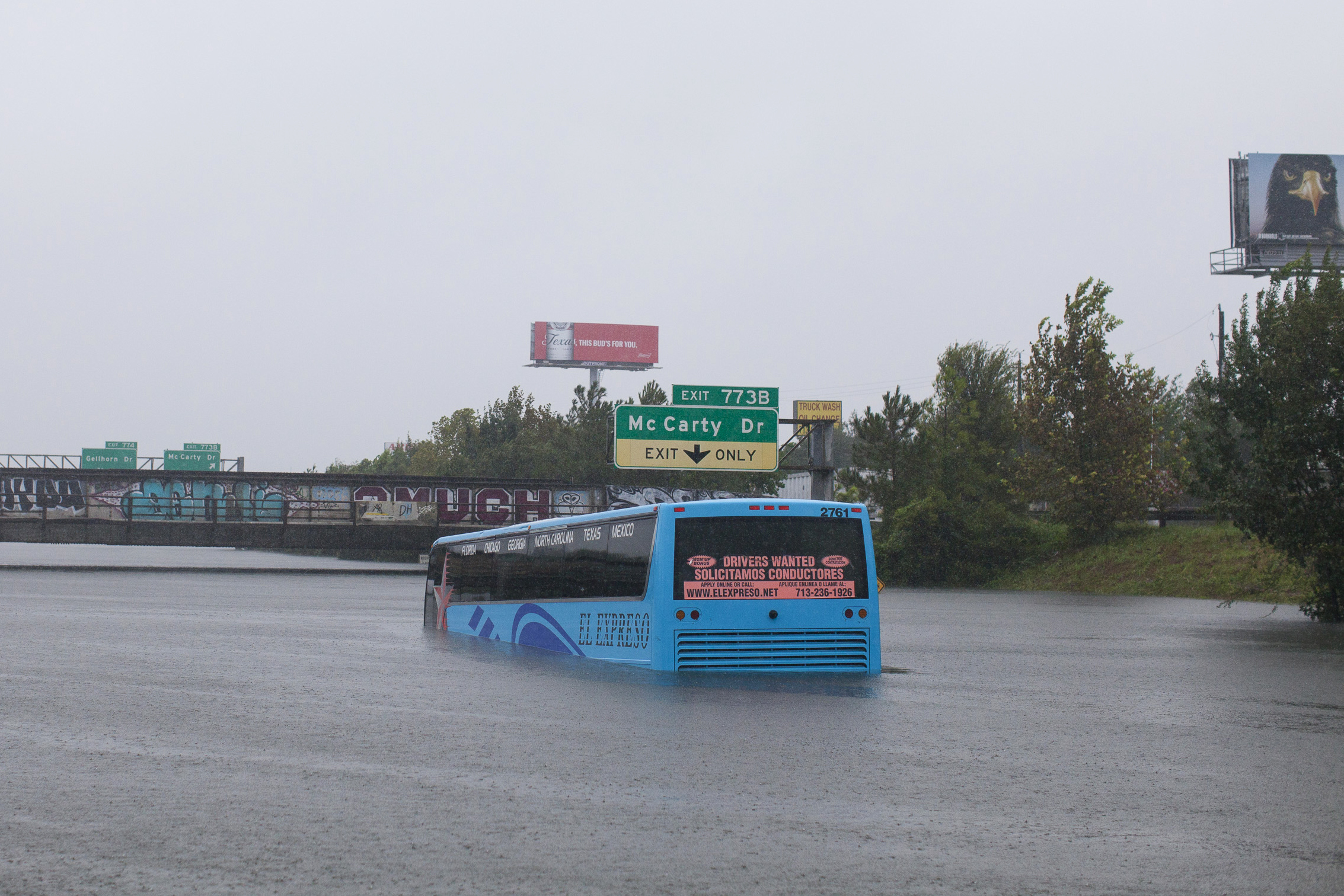 A bus is stuck in the flooded Interstate 10 in Houston on Monday. Hurricane Harvey, a Category 4 storm, made landfall on the Texas coast near Corpus Christi on Friday. (Katie Hayes Luke for NPR)