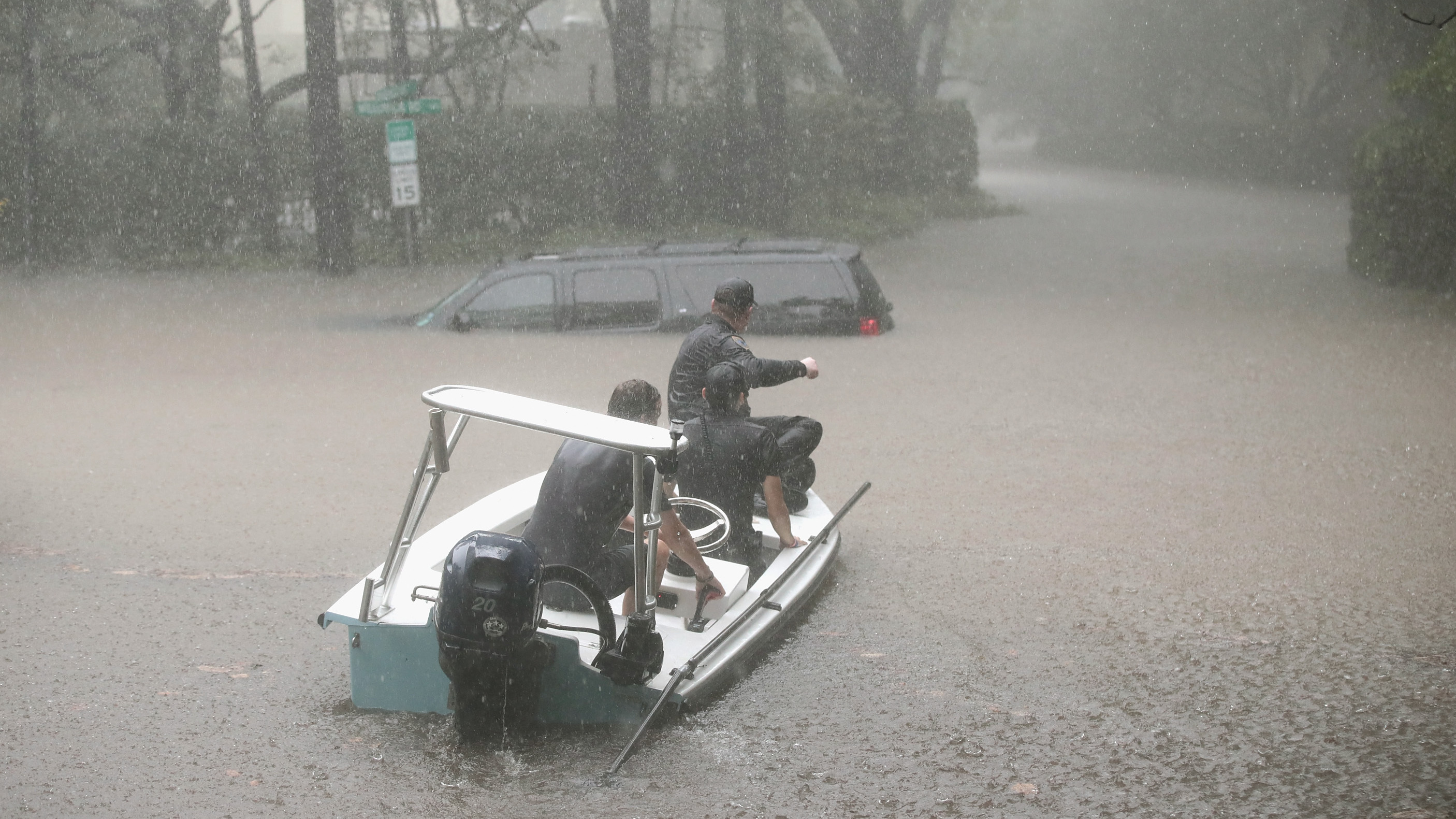 Volunteers and neighborhood security patrol officers help rescue residents after Hurricane Harvey doused Houston with several feet of water over the weekend. (Getty Images)