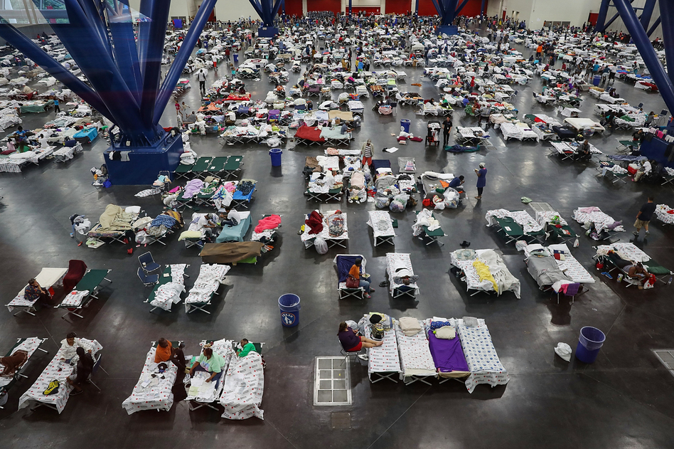 Evacuees fill up cots at a shelter set up inside the George R. Brown Convention Center in Houston, Texas. (Joe Raedle/Getty Images)