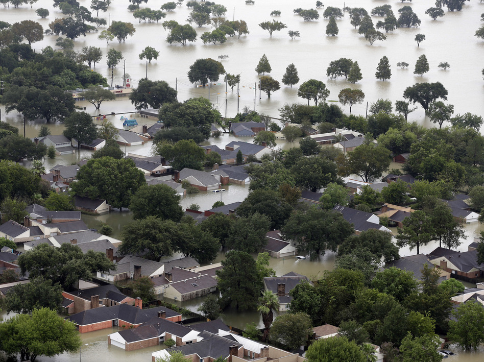 Homes are flooded near the Addicks Reservoir as floodwaters from Tropical Storm Harvey rose on Tuesday in Houston. (David J. Phillip/AP)
