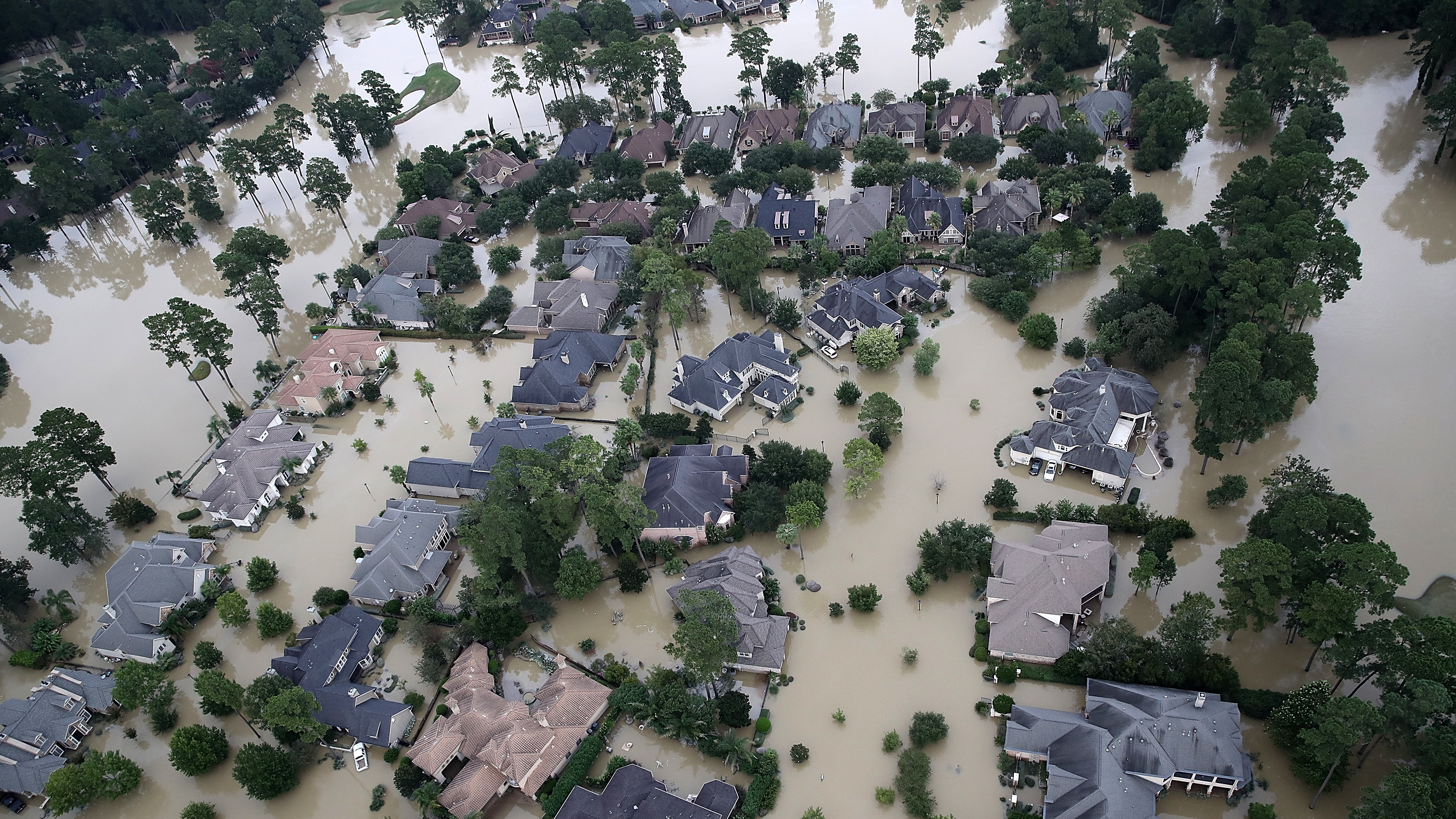 Homes near Lake Houston were almost completely under water on Wednesday. Based on the experiences of past storm victims, returning home could take years. (Getty Images)