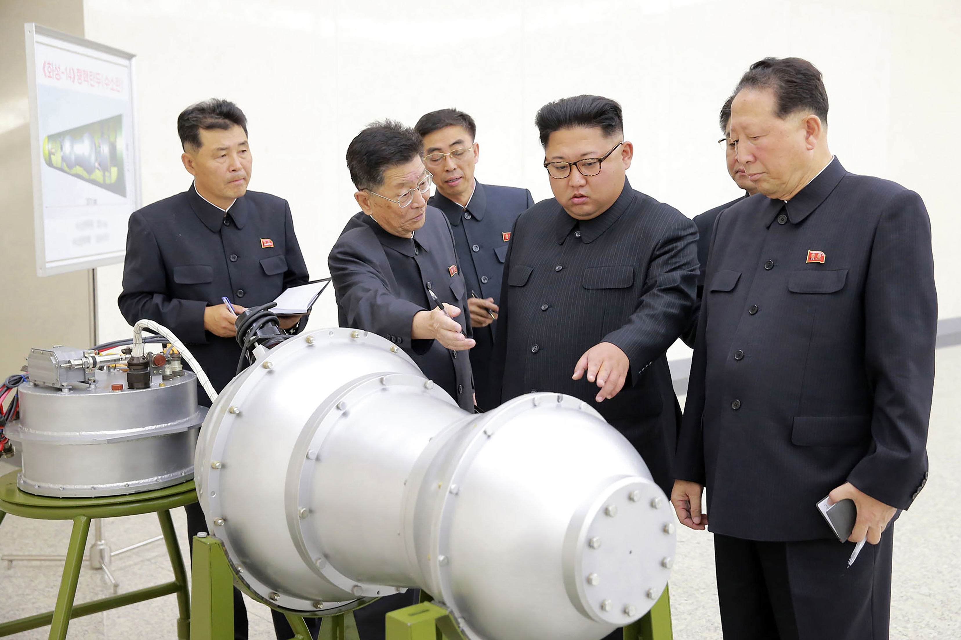 This undated picture released by North Korea's state-run news agency on Sunday shows North Korean leader Kim Jong-Un looking at what Pyongyang claims is a hydrogen bomb, which can be loaded into the country's new intercontinental ballistic missile. (AFP/Getty Images)