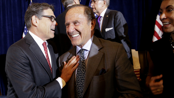 In a photo from 2015, then-Republican presidential candidate, former Texas Gov. Rick Perry, greets New York Daily News publisher Mortimer Zuckerman during a luncheon hosted by the Committee to Unleash Prosperity, at the the Yale Club in New York.