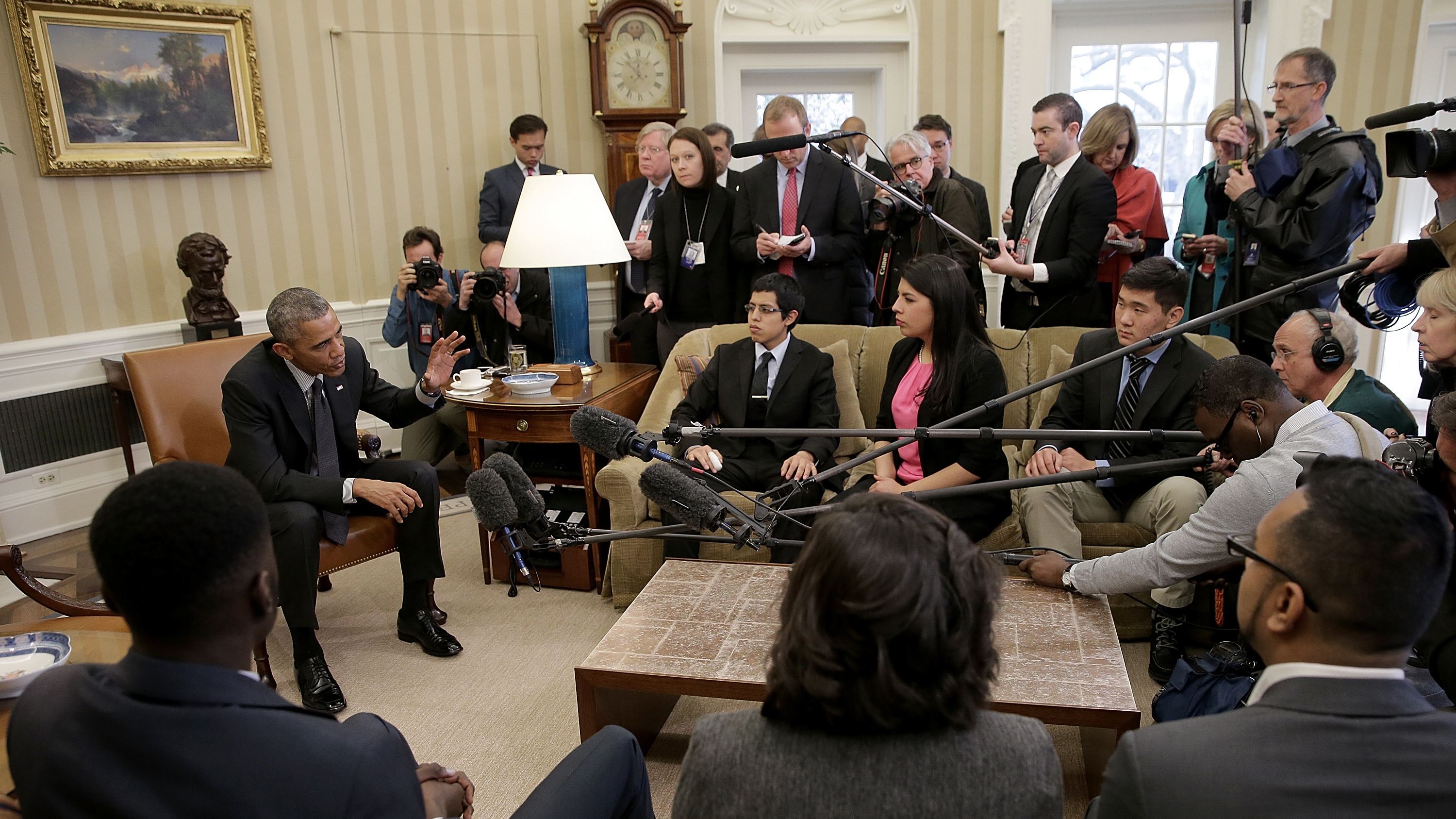 Then-President Barack Obama in a 2015 meeting with a group of DREAMers, who received protection from Deferred Action for Childhood Arrivals. Obama reacted strongly to President Trump's reversal of the policy. (Getty Images)