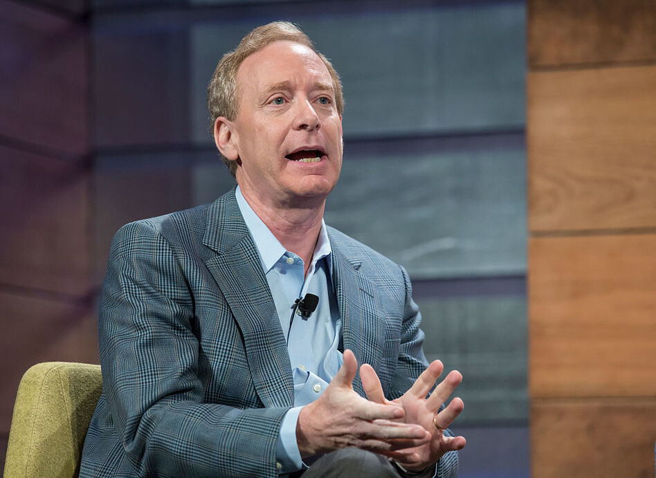 Brad Smith speaks at the Microsoft Annual Shareholders meeting in 2015. The Microsoft president issued sharp words Tuesday against President Trump's decision to cancel DACA in six months and called on Congress to make immigration a top priority. (Stephen Brashear/Getty Images)