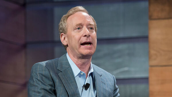 Brad Smith speaks at the Microsoft Annual Shareholders meeting in 2015. The Microsoft president issued sharp words Tuesday against President Trump