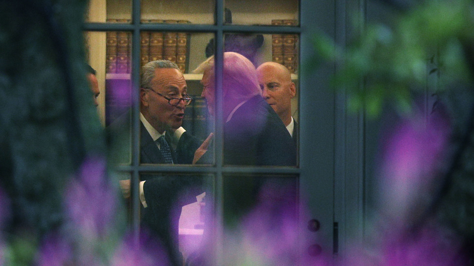 Democratic Senate Minority Leader Chuck Schumer of New York and President Trump embrace in the Oval Office after a meeting at which Trump agreed with Democrats, casting aside Republicans. (Alex Wong/Getty Images)