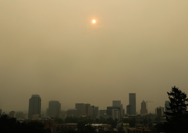 The sun was barely visible over downtown Portland on Wednesday because of wildfires burning east of the city in the Columbia River Gorge.