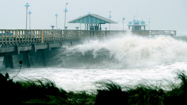 Large waves produced by Hurricane Irma crash into the end of a pier Sunday in Fort Lauderdale, Fla. At the same time this photo was being taken, the hurricane was making landfall in the Florida Keys as a Category 4 storm.