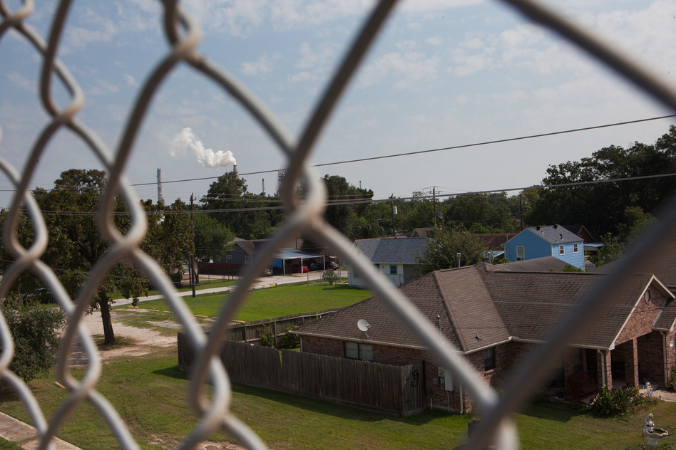 A smokestack rises in the background over the East Houston community of Manchester, <strong></strong><strong></strong>Texas, where the air was heavy with what smelled like gasoline after Hurricane Harvey in late August. The neighborhood is ringed by industrial sites. (Claire Harbage/NPR)