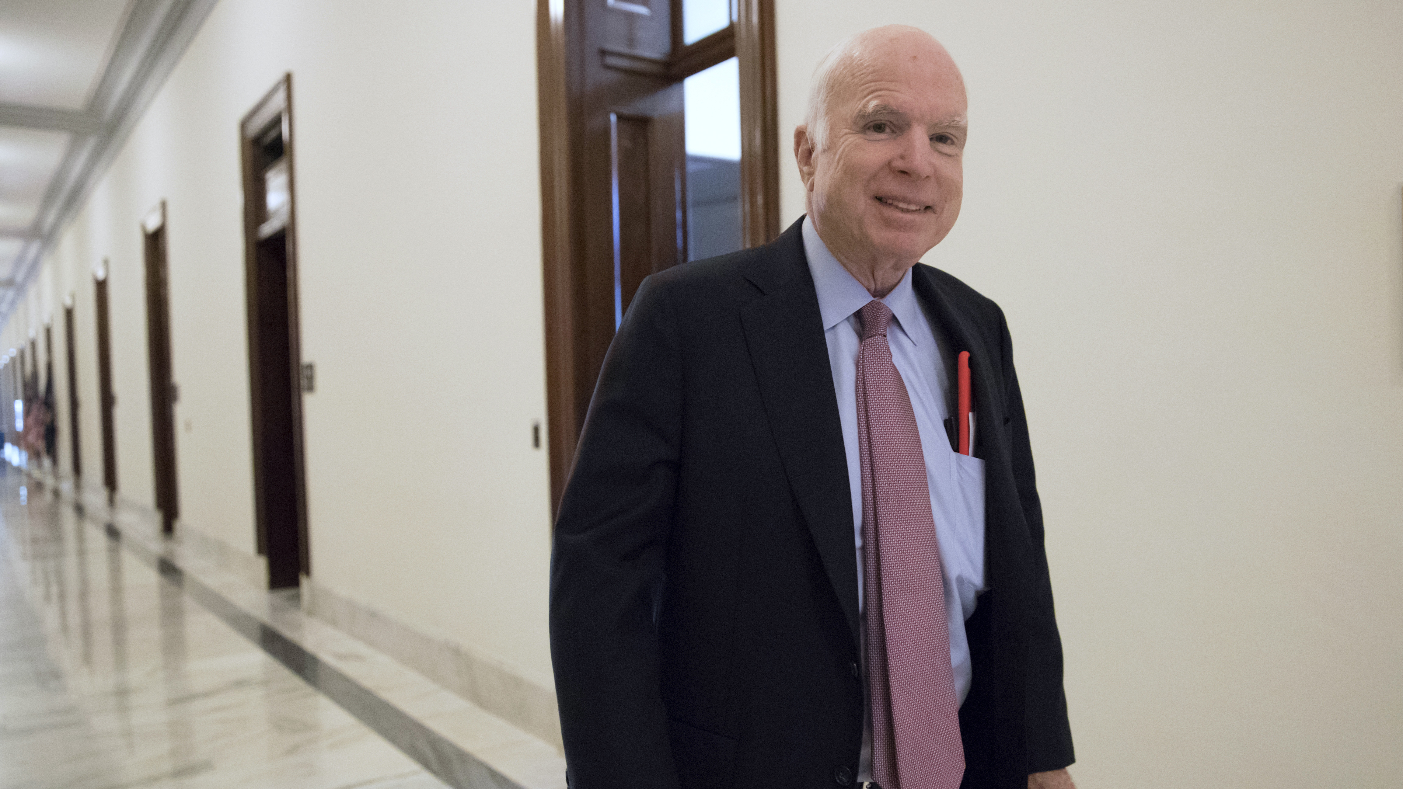 Sen. John McCain, R-Ariz., walks from his Senate office.