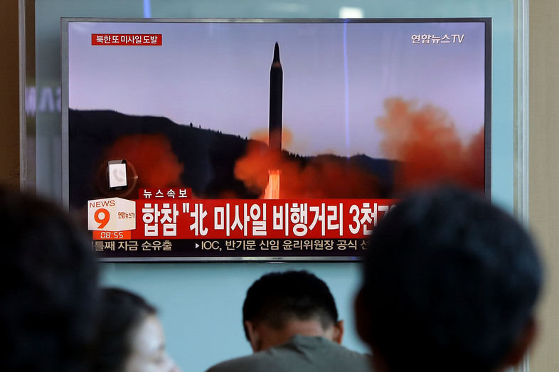 People at the Seoul Railway Station in the South Korean capital watch a TV report on North Korea's missile launch on Friday, days after the U.N. Security Council adopted new sanctions against Pyongyang. (Chung Sung-Jun/Getty Images)