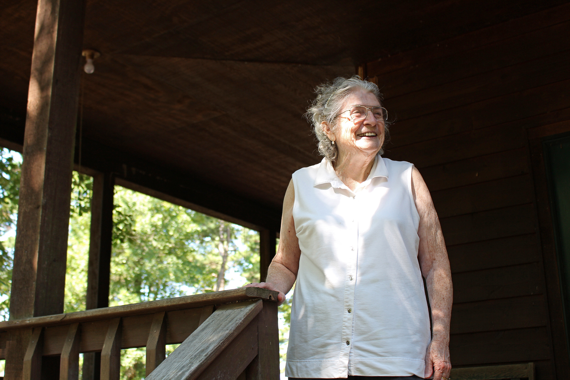 Lulabelle Berry surveys the 600 acres she and her husband, Jimmy, own in the Ozarks near Mountain View, Ark. Berry walks laps on her porch to aid her recovery from a stroke. She says she's grateful for the drug that saved her life. &quot;It's been a good life,&quot; she says. (Sarah Jane Tribble for Kaiser Health News)