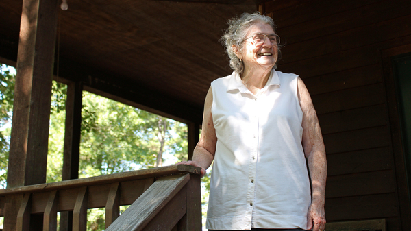 Lulabelle Berry surveys the 600 acres she and her husband, Jimmy, own in the Ozarks near Mountain View, Ark. Berry walks laps on her porch to aid her recovery from a stroke. She says she