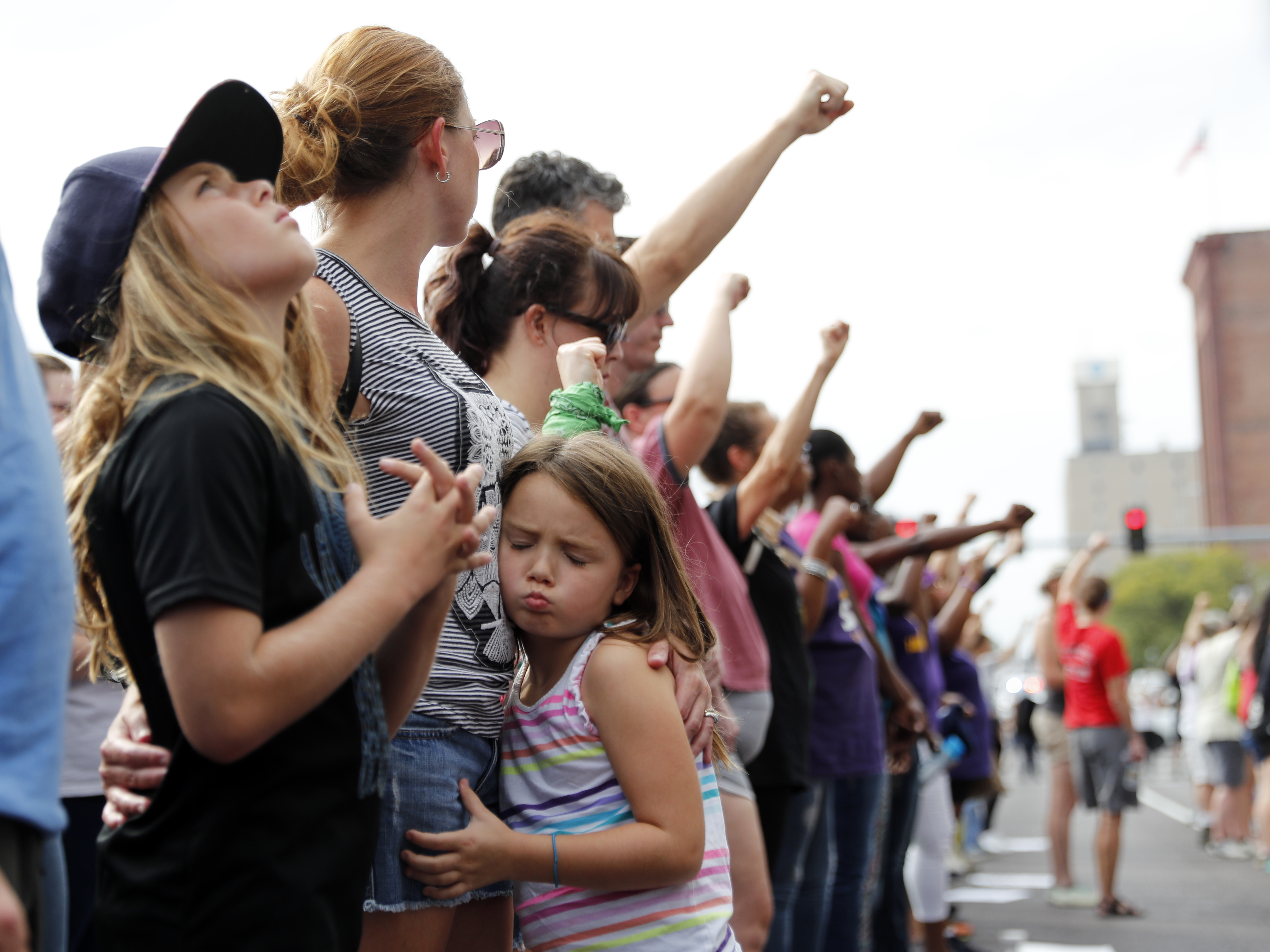 Demonstrations have taken to the streets every day since a white former St. Louis police officer was acquitted Friday in the 2011 killing of a black man. On Saturday, protesters stood silently outside the St. Louis Police Department headquarters. (Jeff Roberson/AP)