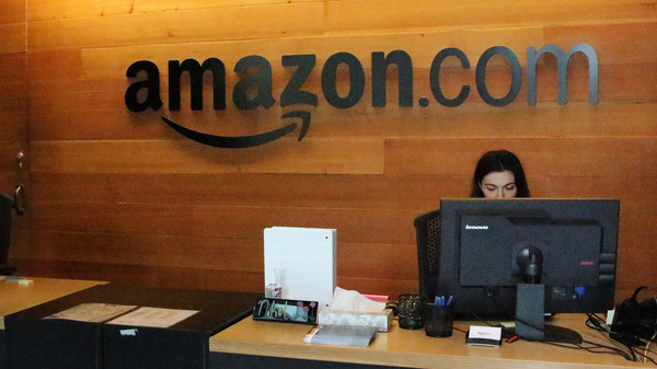 Nikol Szymul staffs a reception desk at Amazon offices in downtown Seattle. Online retail powerhouse Amazon is searching for a second headquarters location, which an official from Toronto has called "the Olympics of the corporate world."