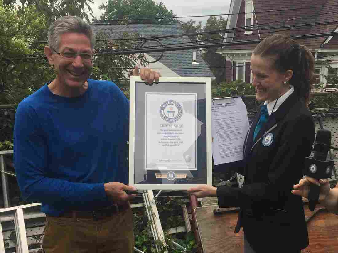 Ashrita Furman broke the Guinness World Record for most balloons burst with chopsticks in one minute.