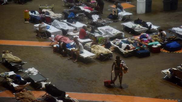 Residents seek shelter inside Roberto Clemente Coliseum in San Juan, Puerto Rico, early on Wednesday, as Hurricane Maria struck the island.